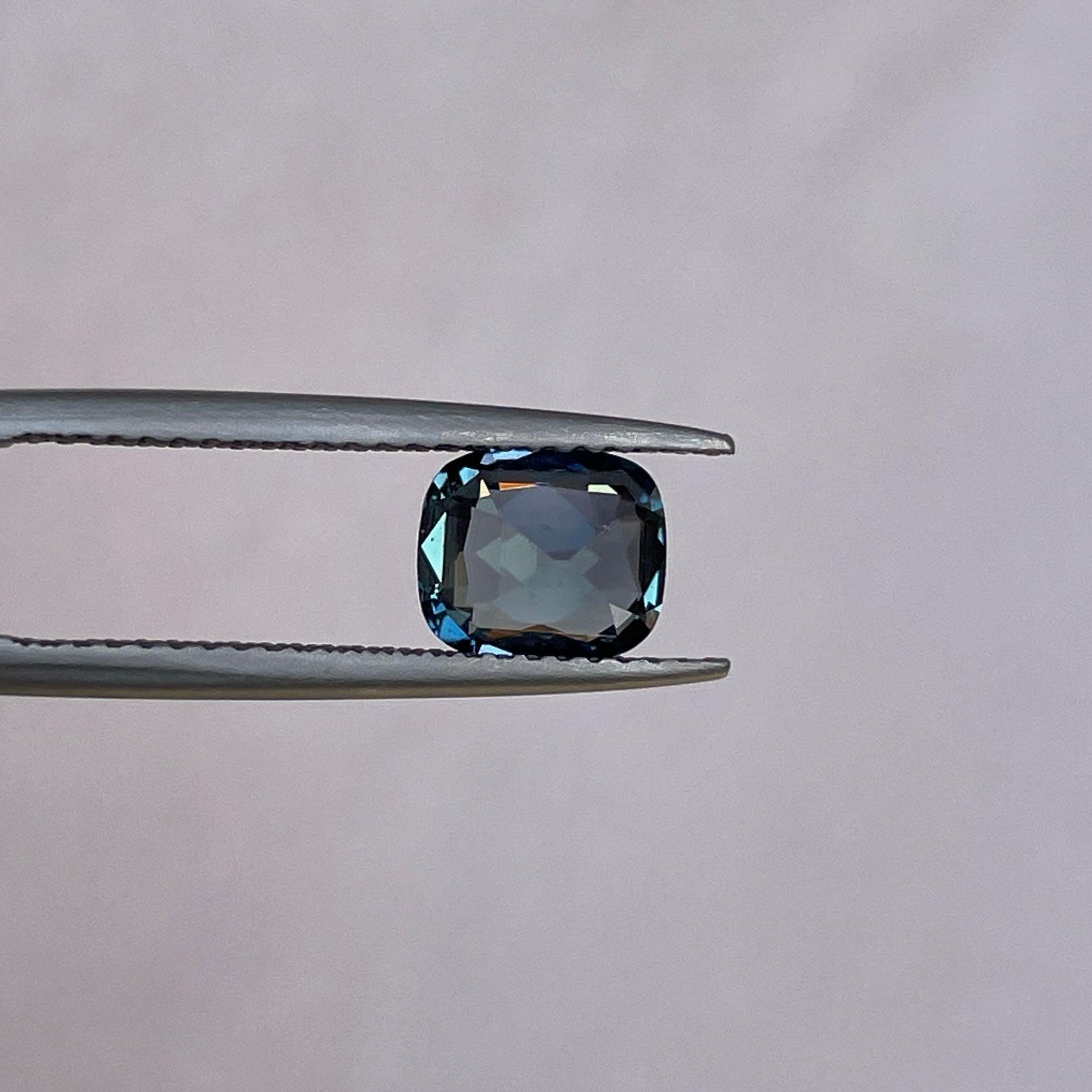 teal blue green parti sapphire cushion cut gem