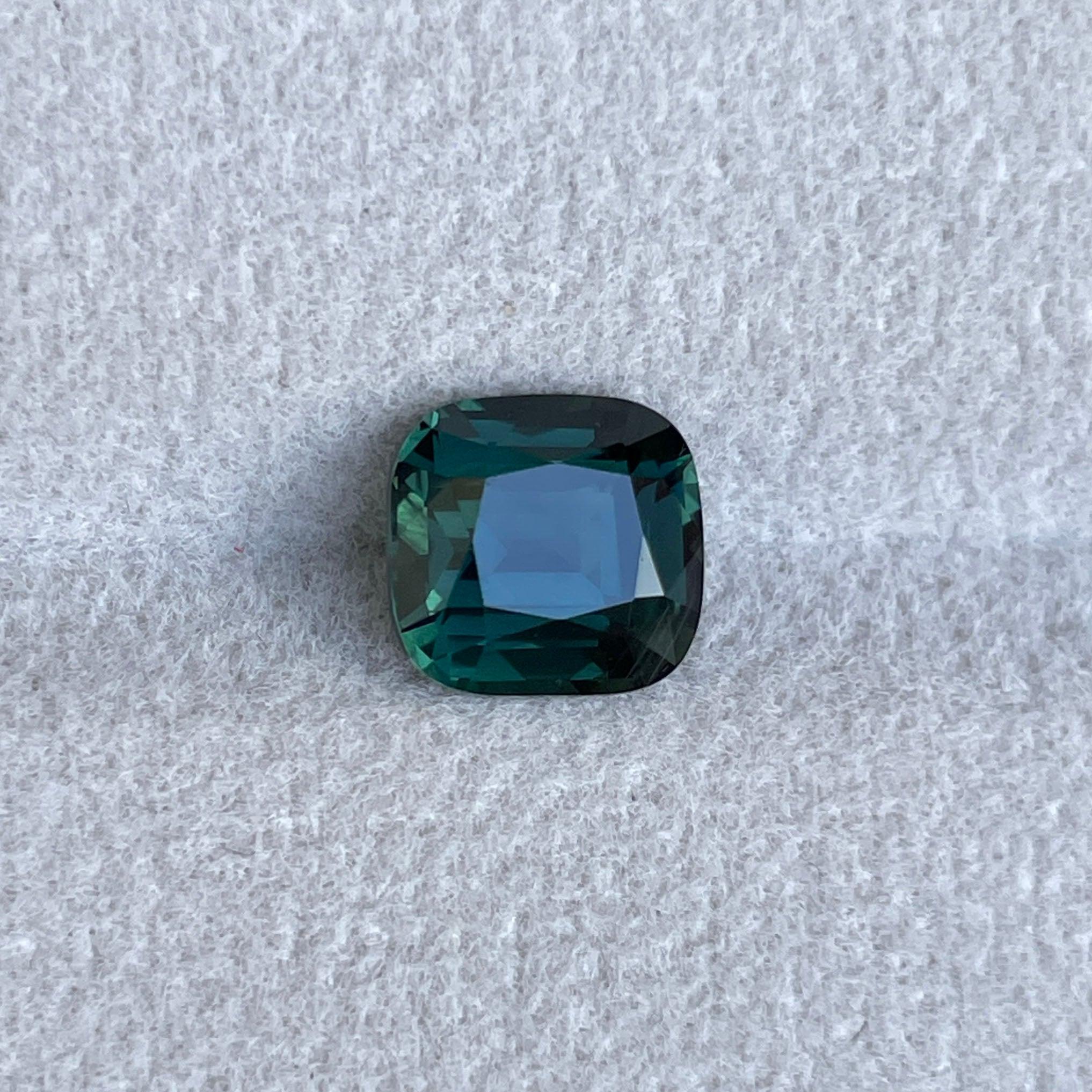 teal blue green parti sapphire cushion cut gem