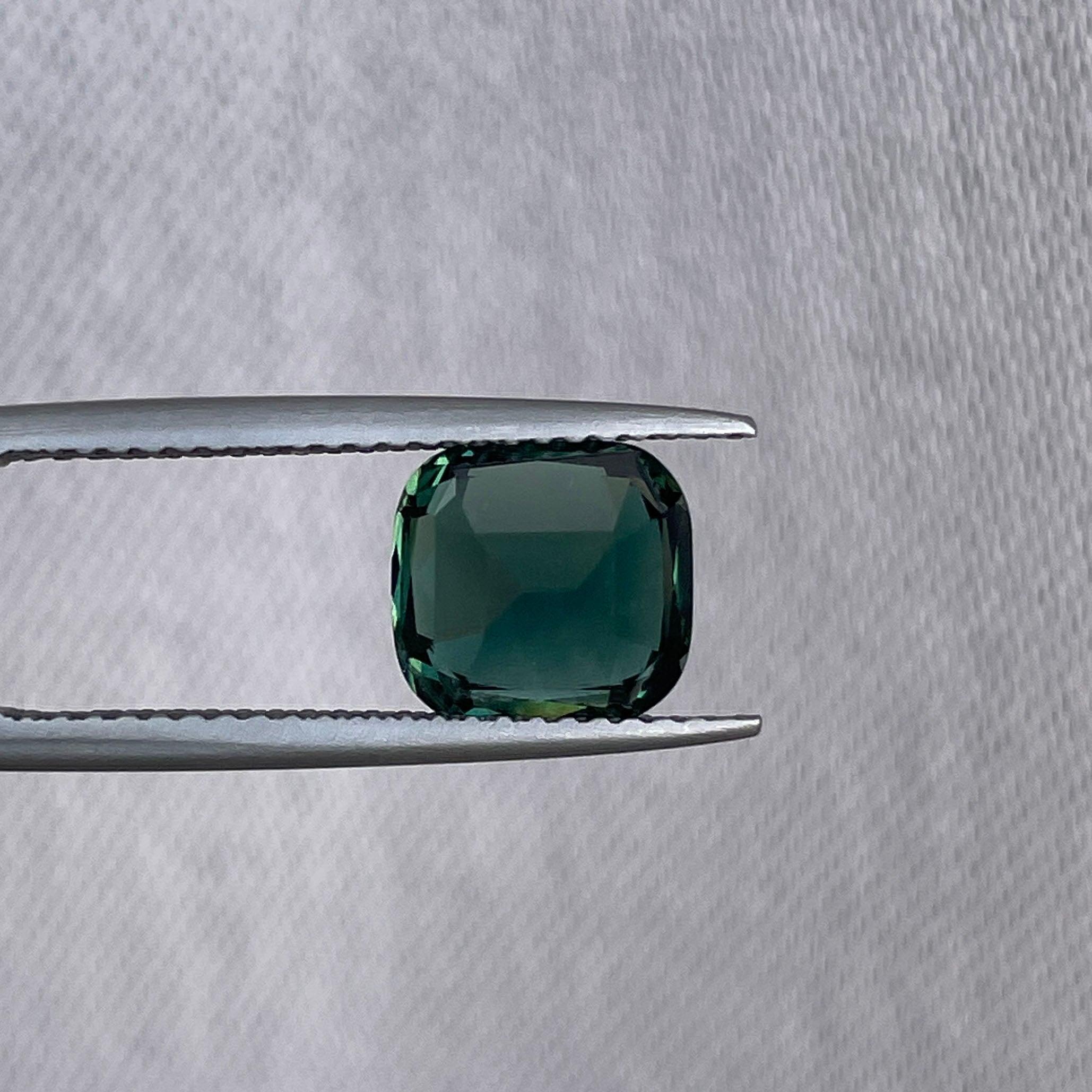teal blue green parti sapphire cushion cut gem
