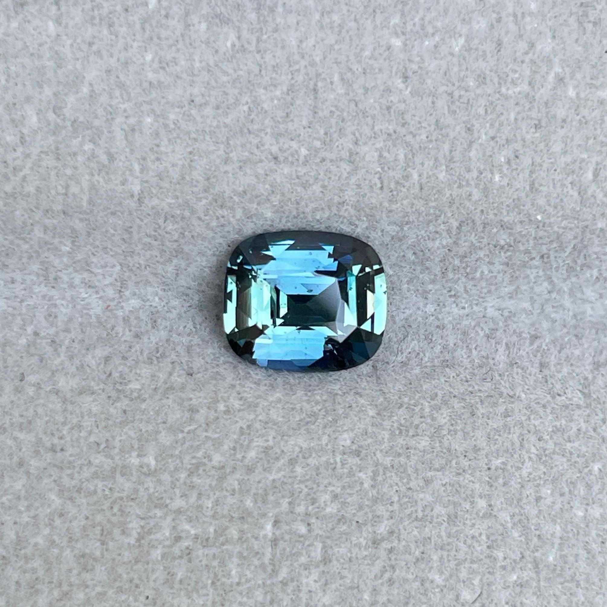 teal blue green parti sapphire cushion cut gem