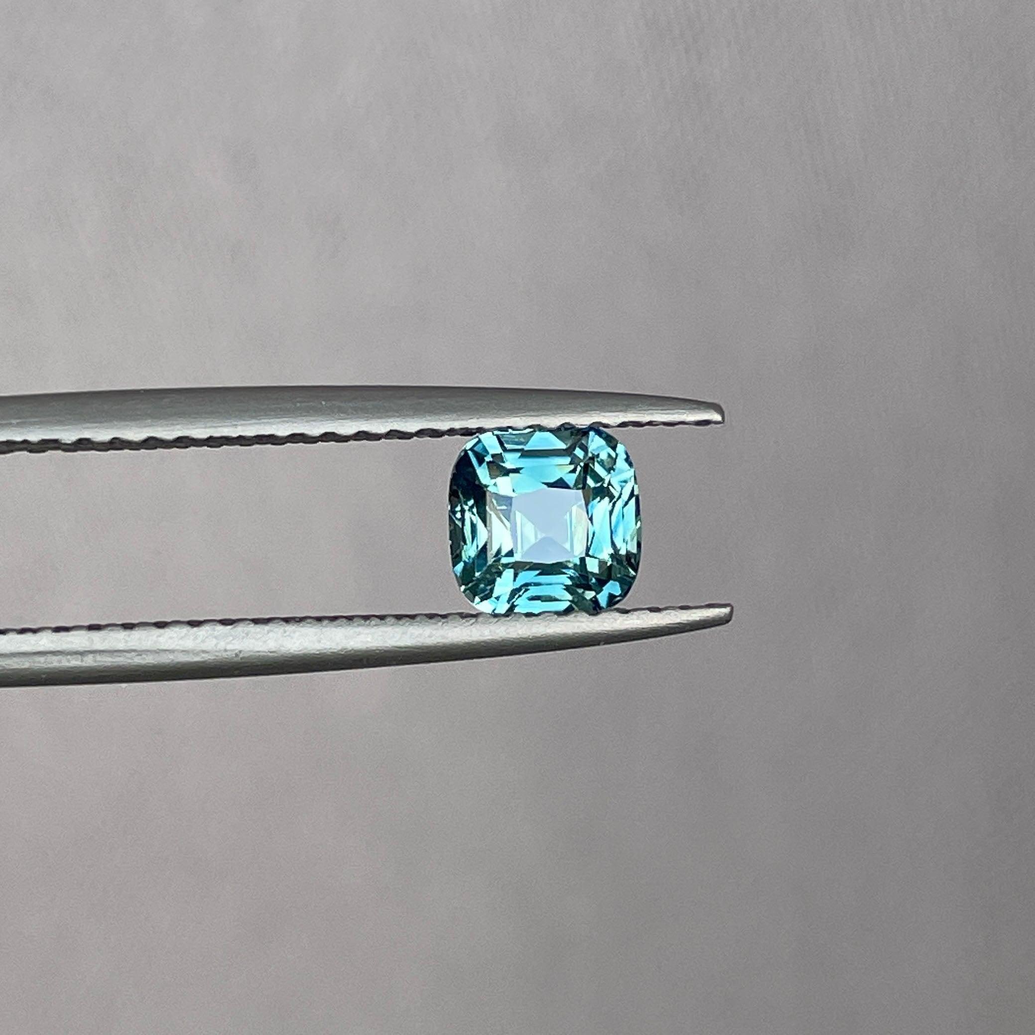 teal blue green parti sapphire cushion cut gem