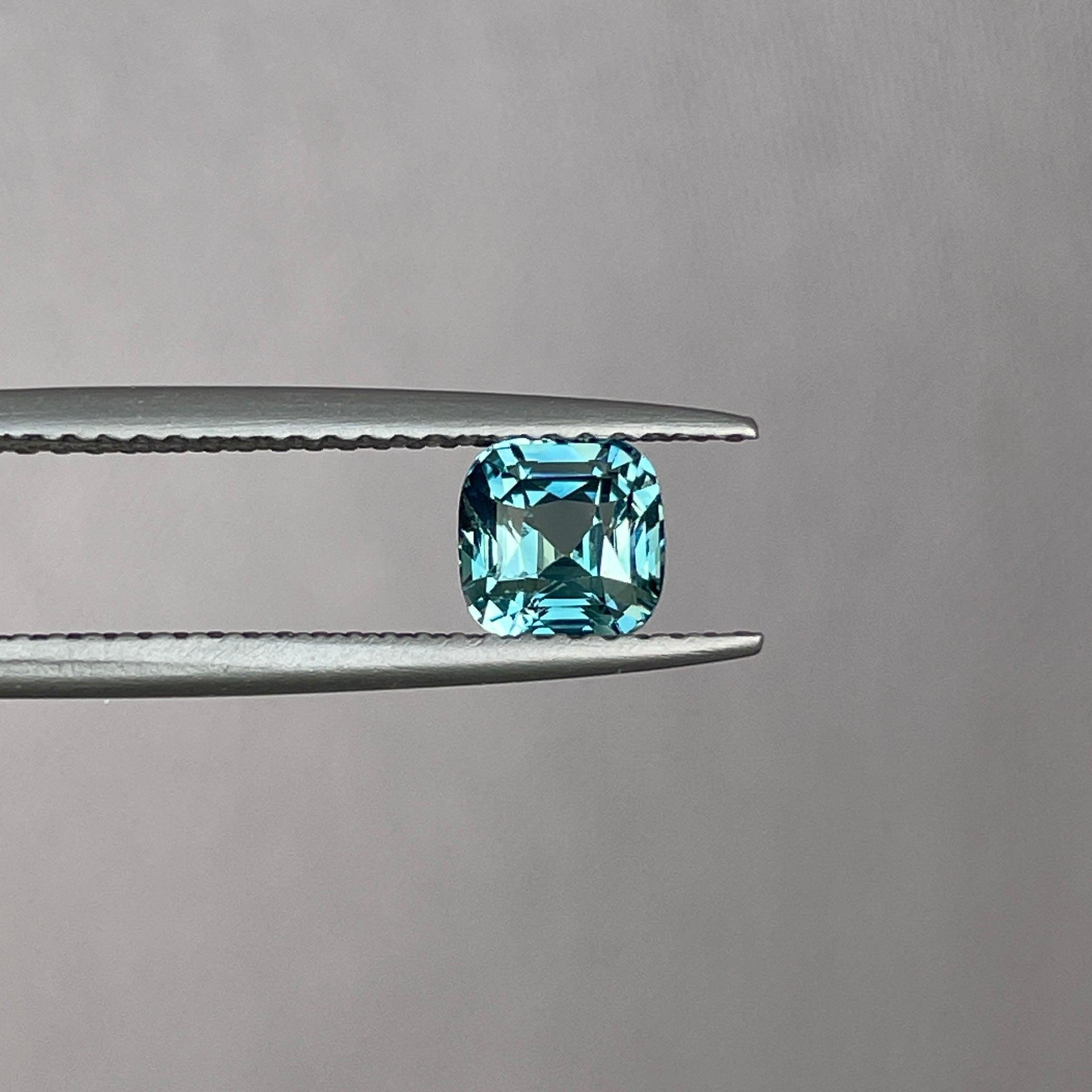 teal blue green parti sapphire cushion cut gem