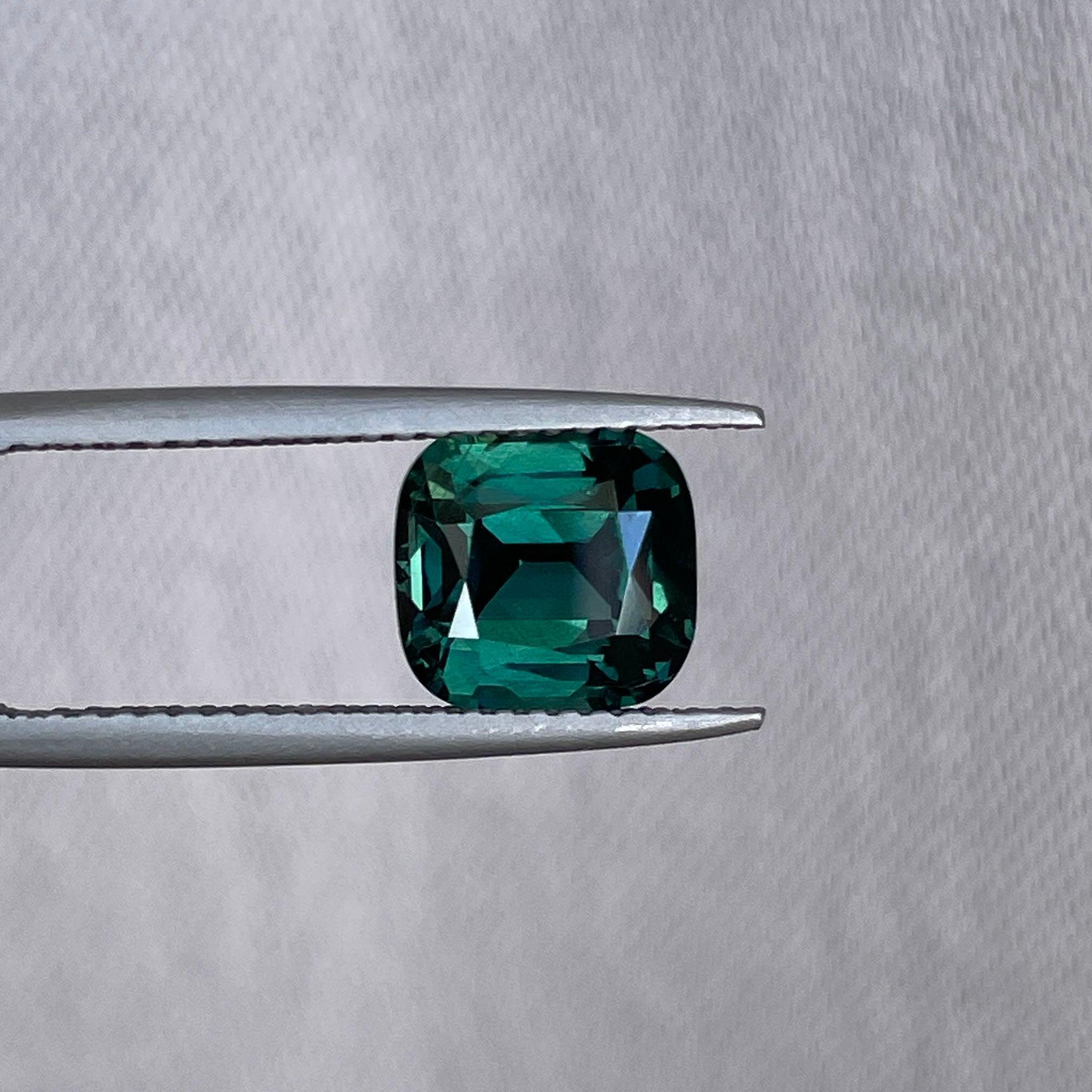 teal blue green parti sapphire cushion cut gem