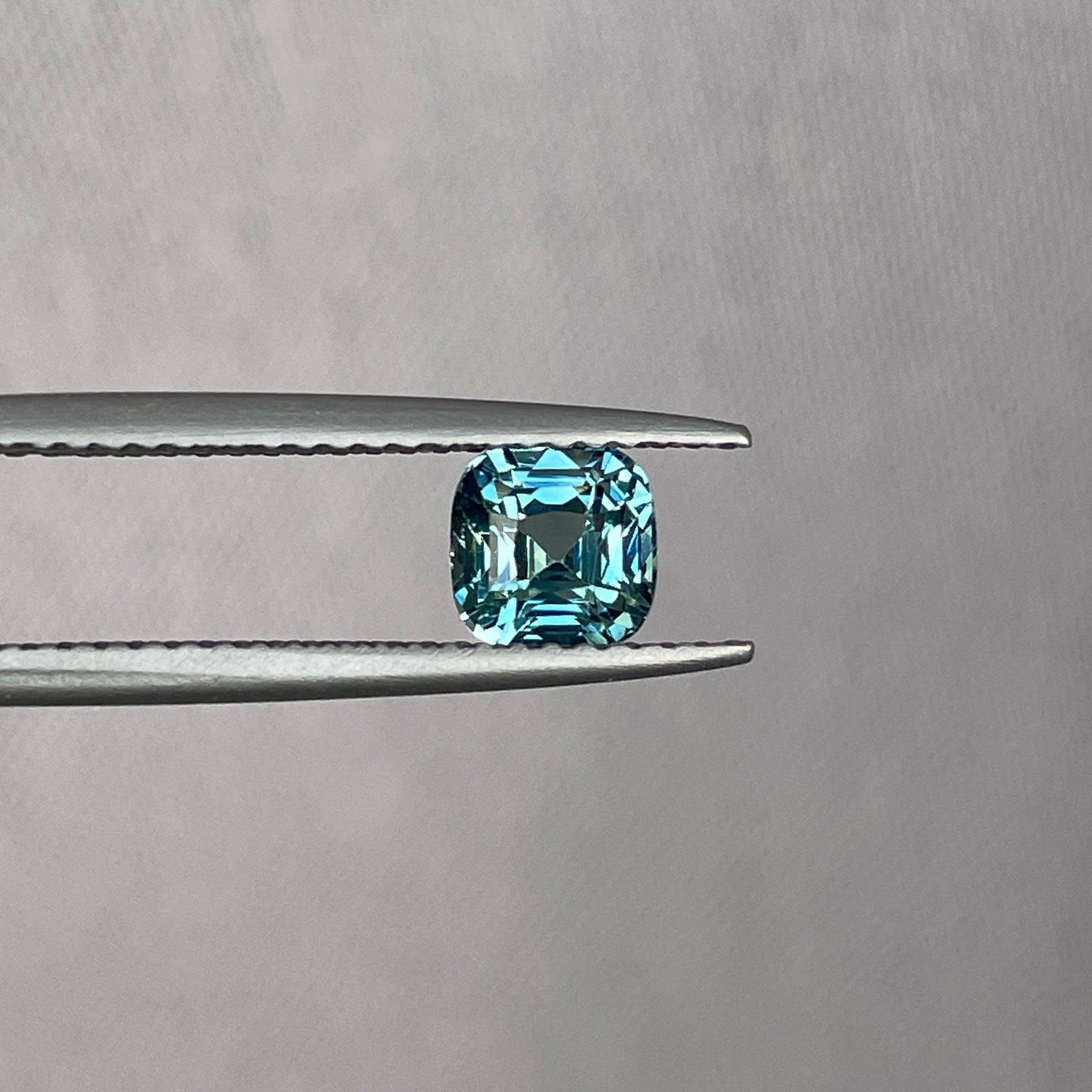 teal blue green parti sapphire cushion cut gem