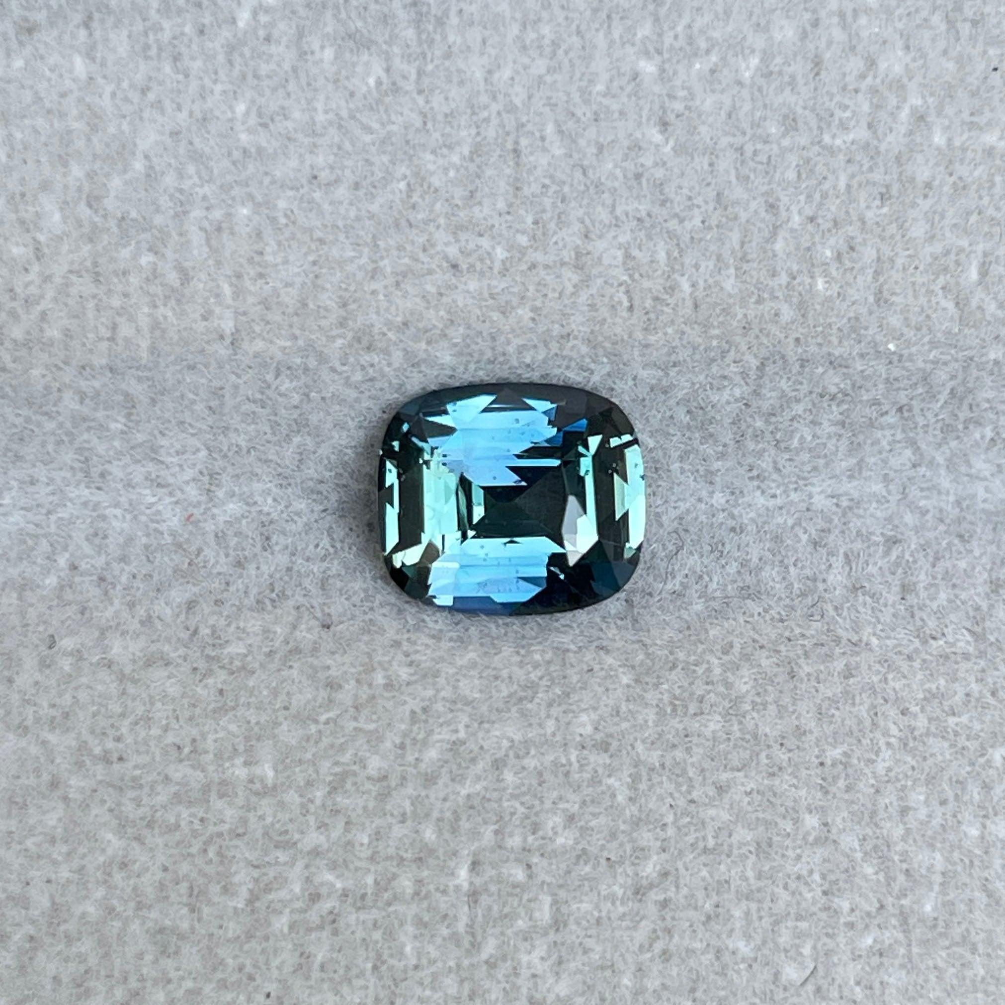 teal blue green parti sapphire cushion cut gem