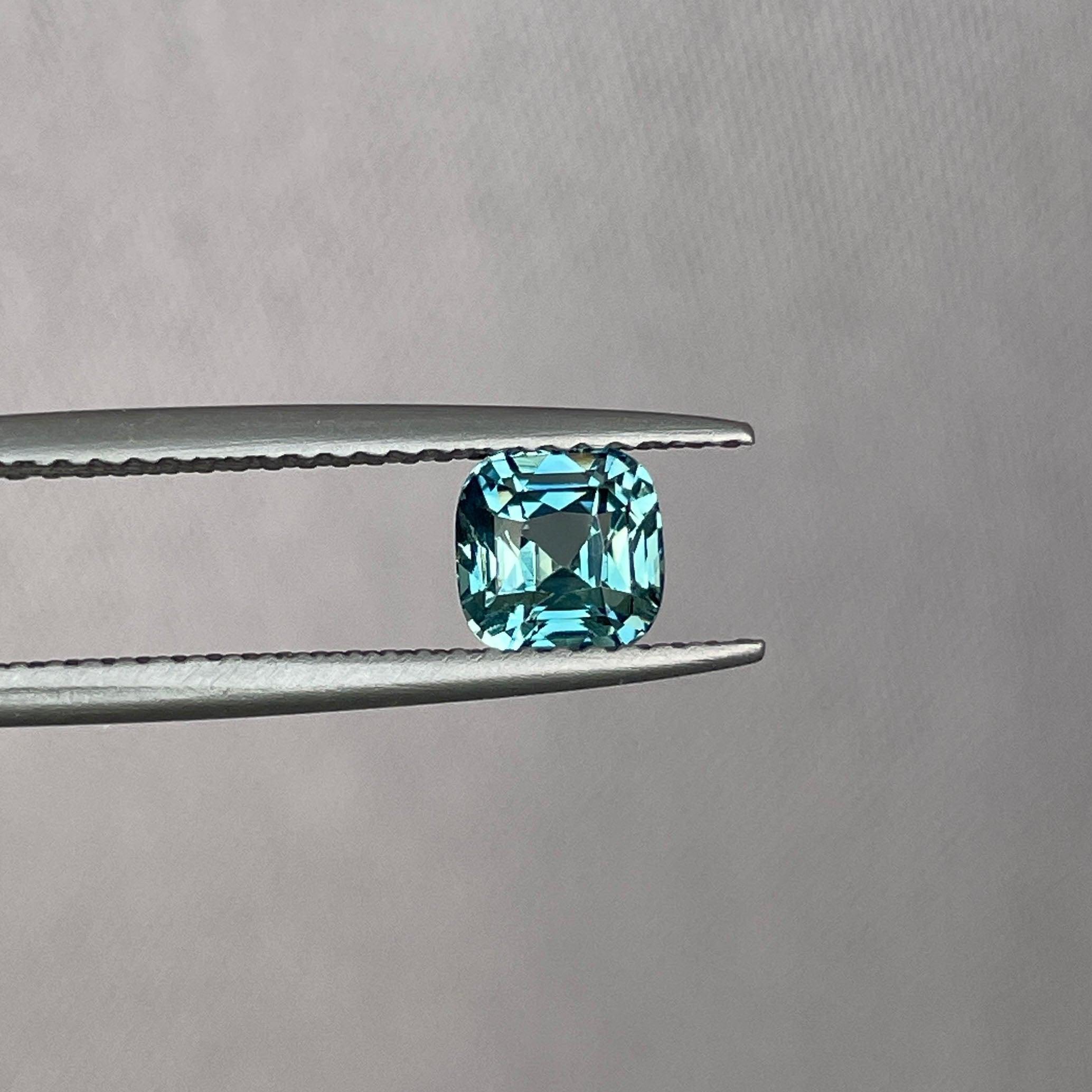 teal blue green parti sapphire cushion cut gem