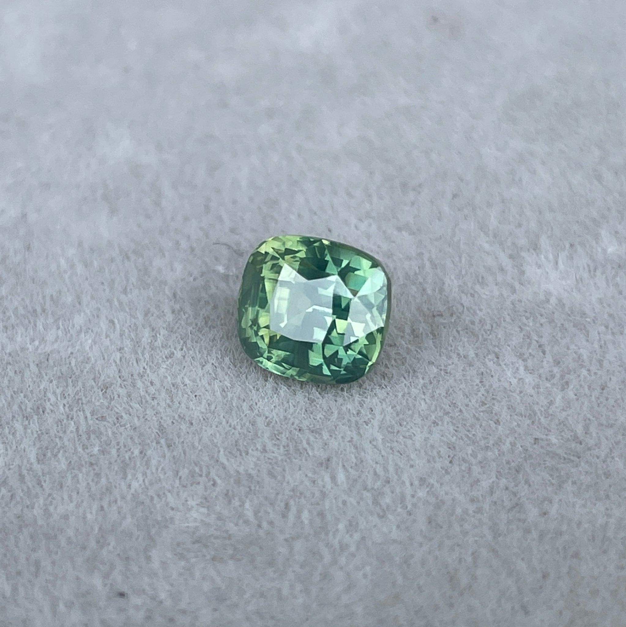 teal blue green parti sapphire cushion cut gem