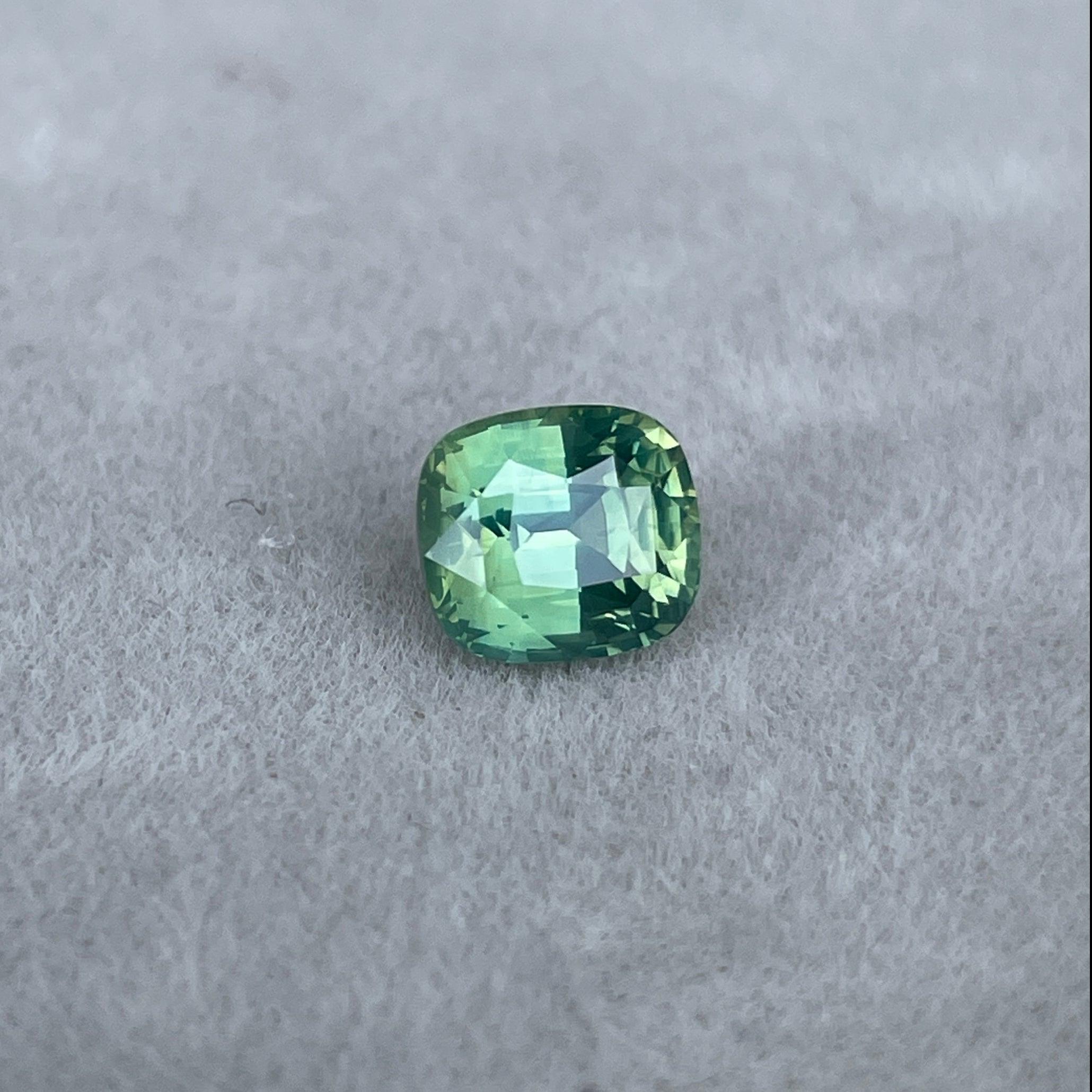 teal blue green parti sapphire cushion cut gem