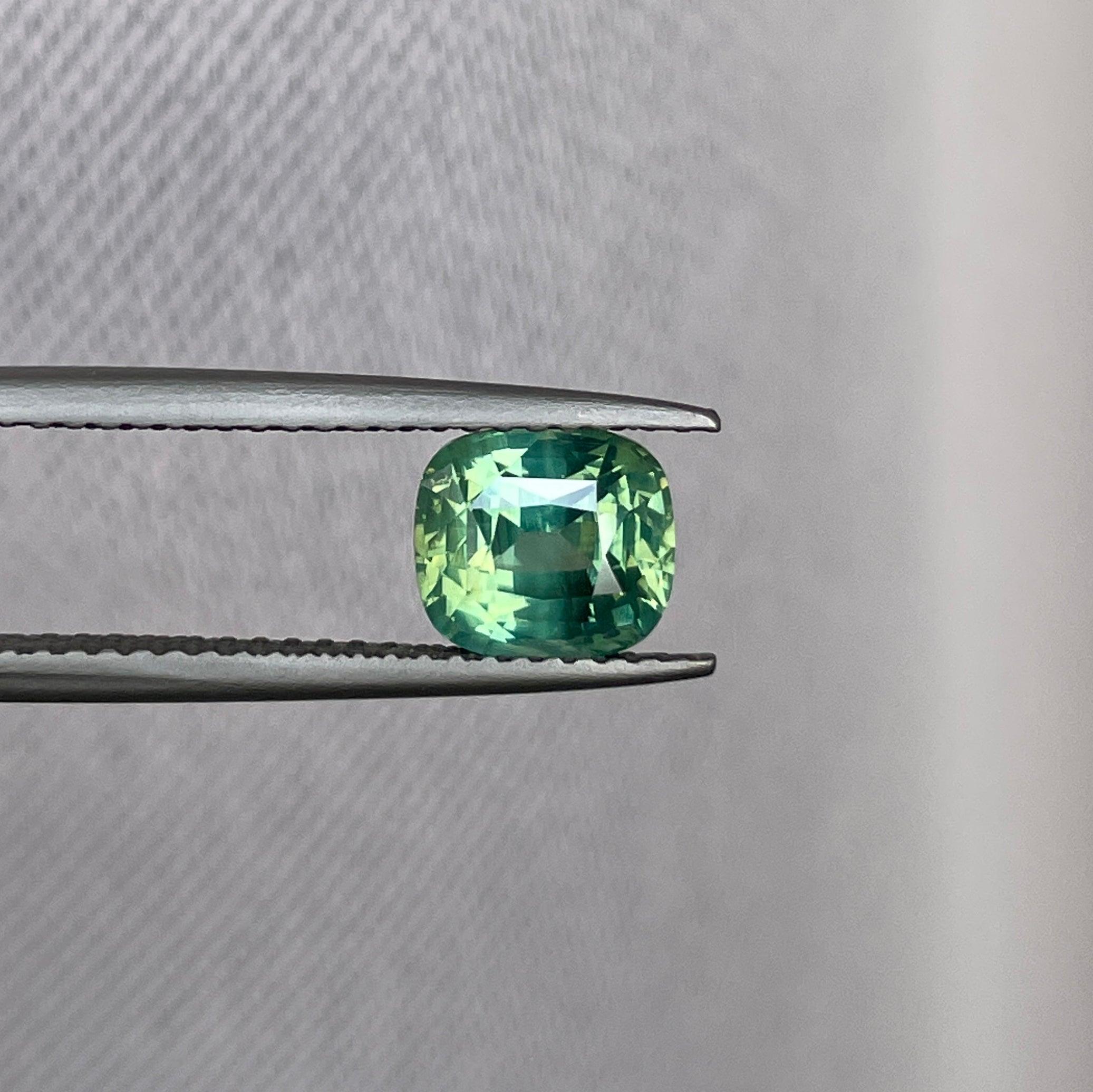 teal blue green parti sapphire cushion cut gem