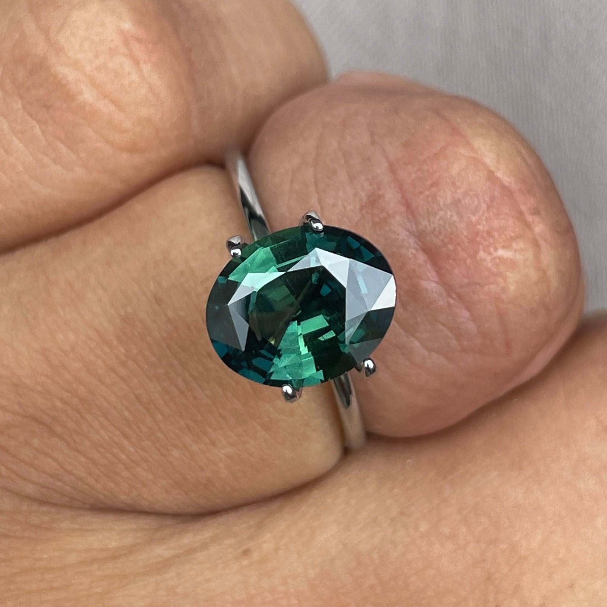 teal blue green parti sapphire oval cut gem