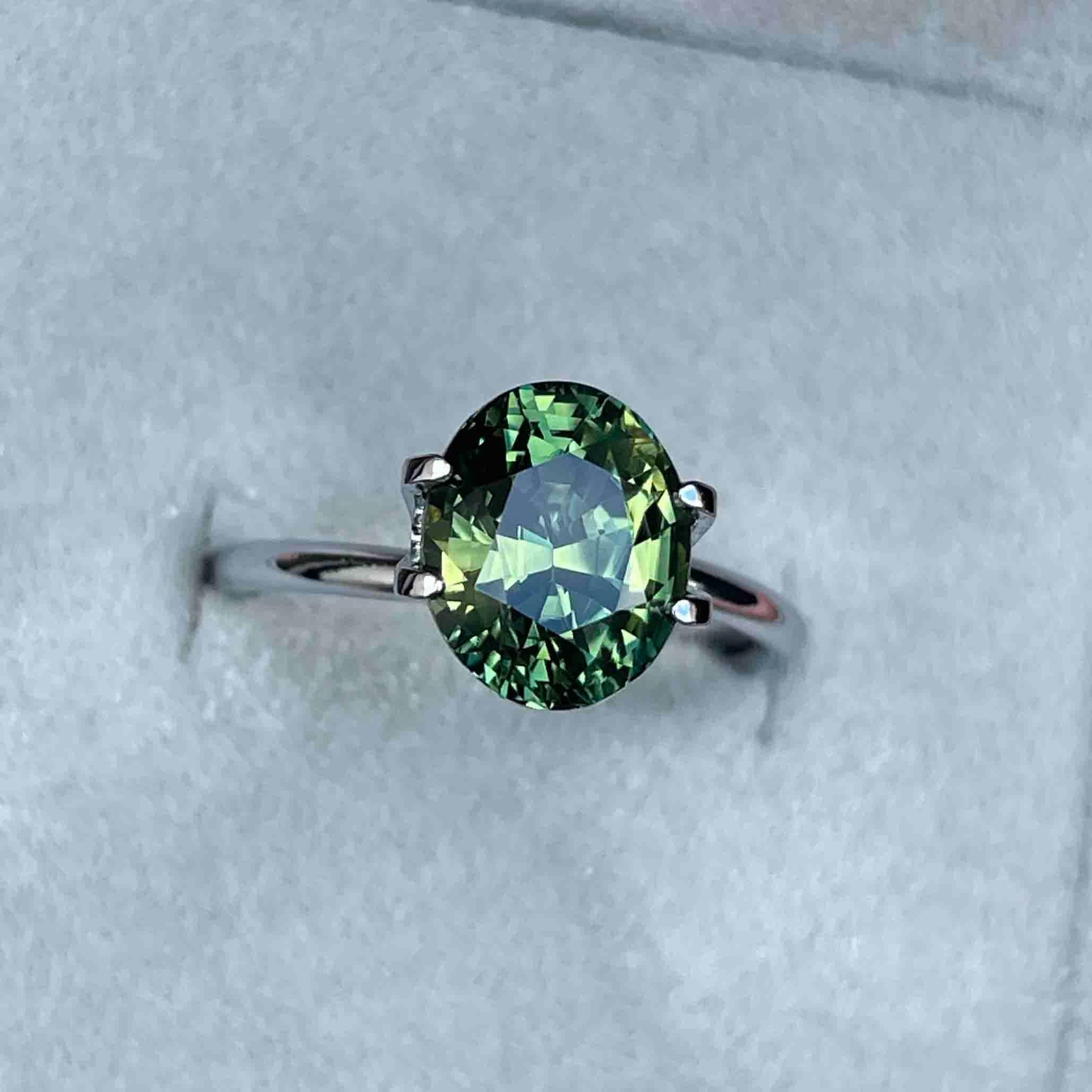 teal blue green parti sapphire oval cut gem