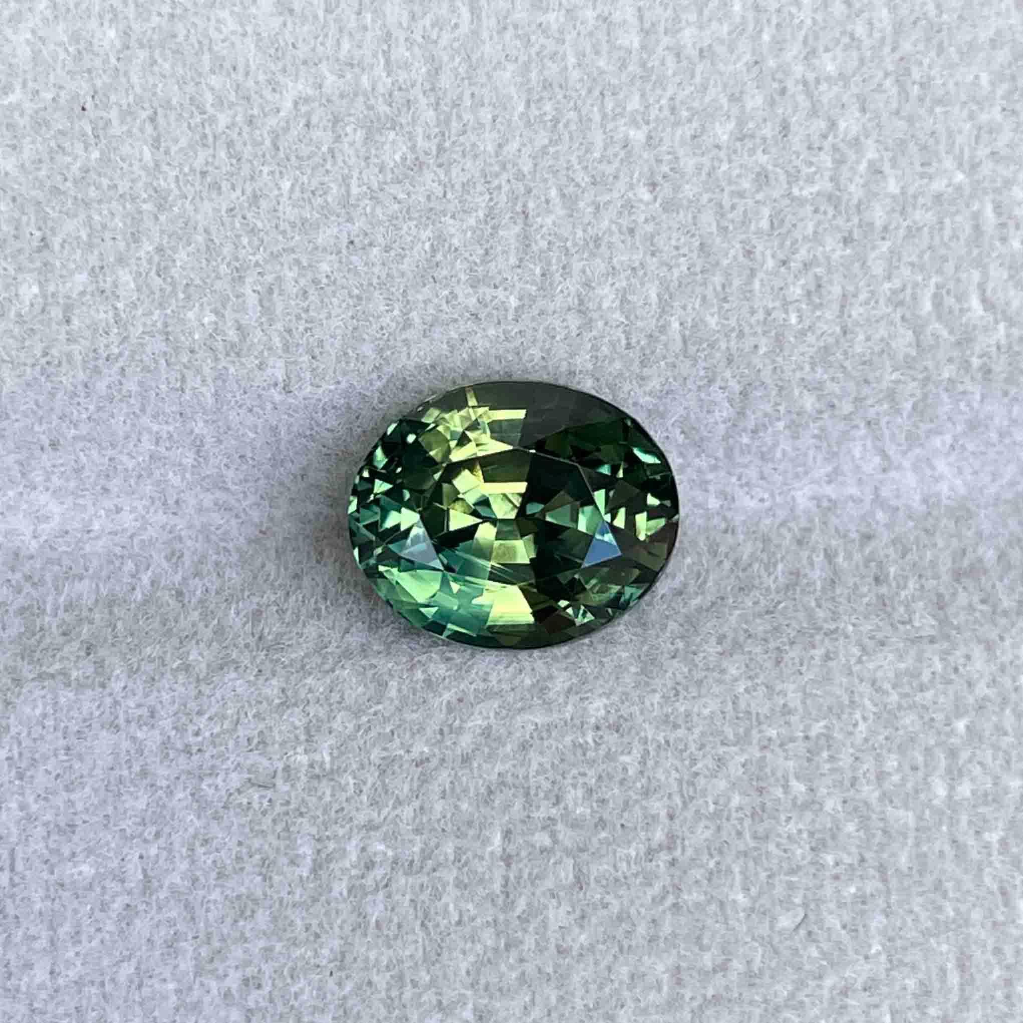 teal blue green parti sapphire oval cut gem