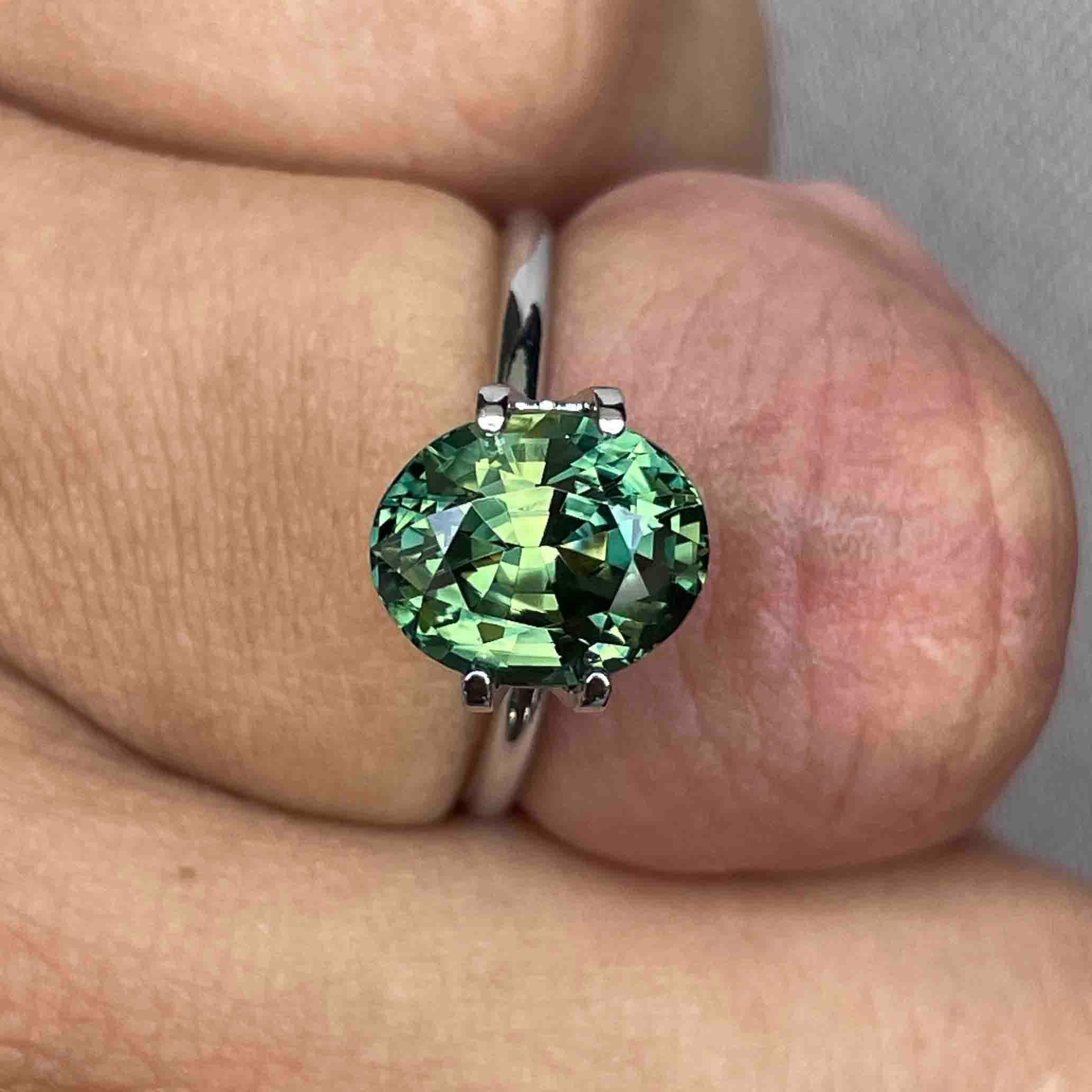 teal blue green parti sapphire oval cut gem
