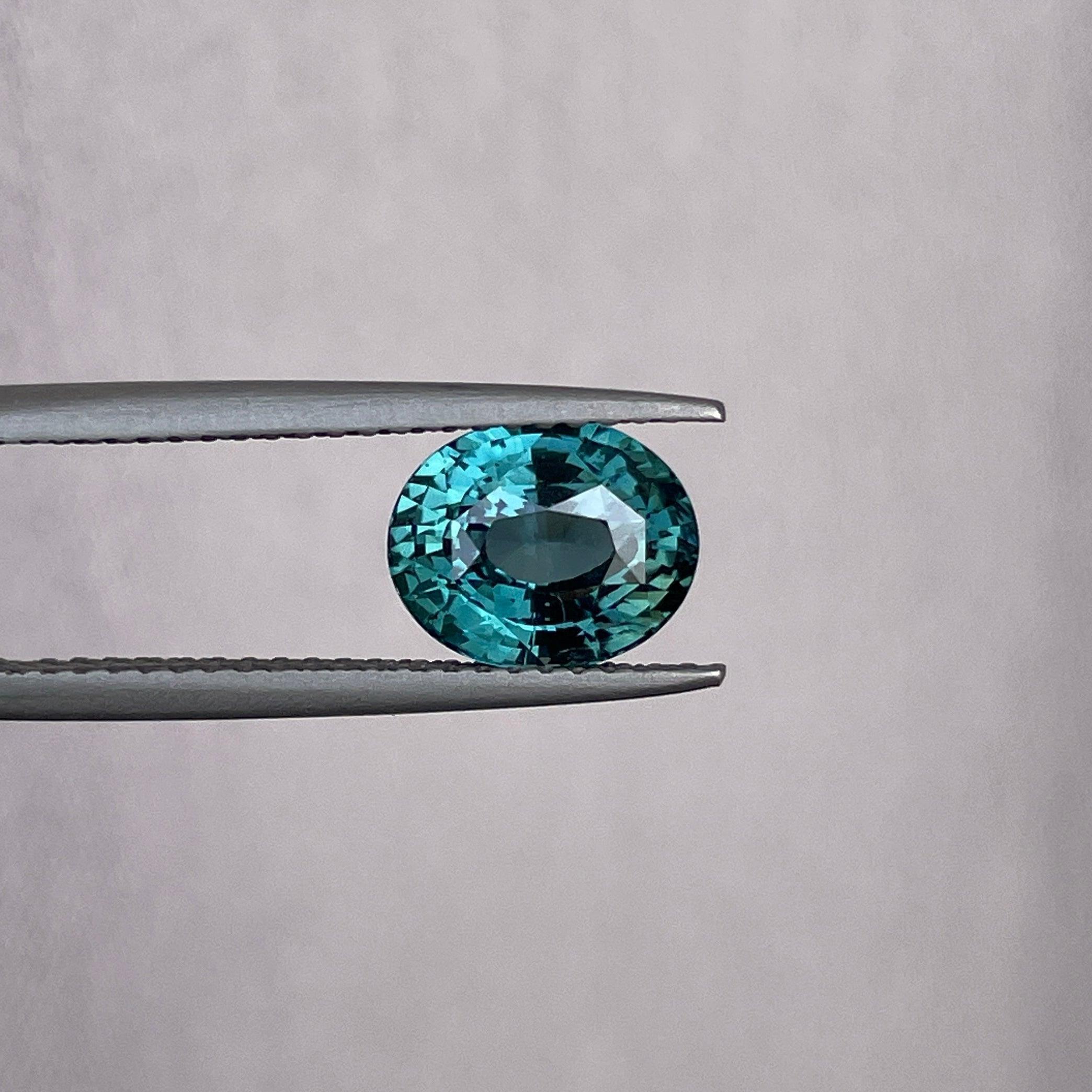 teal blue green parti sapphire oval cut gem
