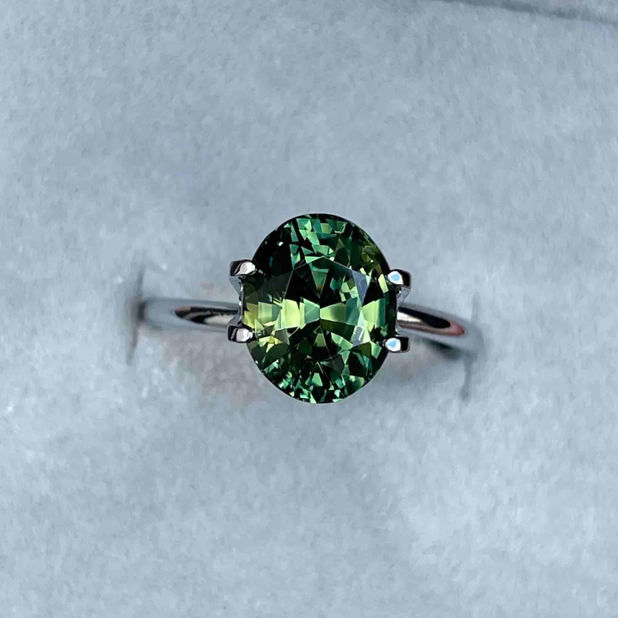 teal blue green parti sapphire oval cut gem