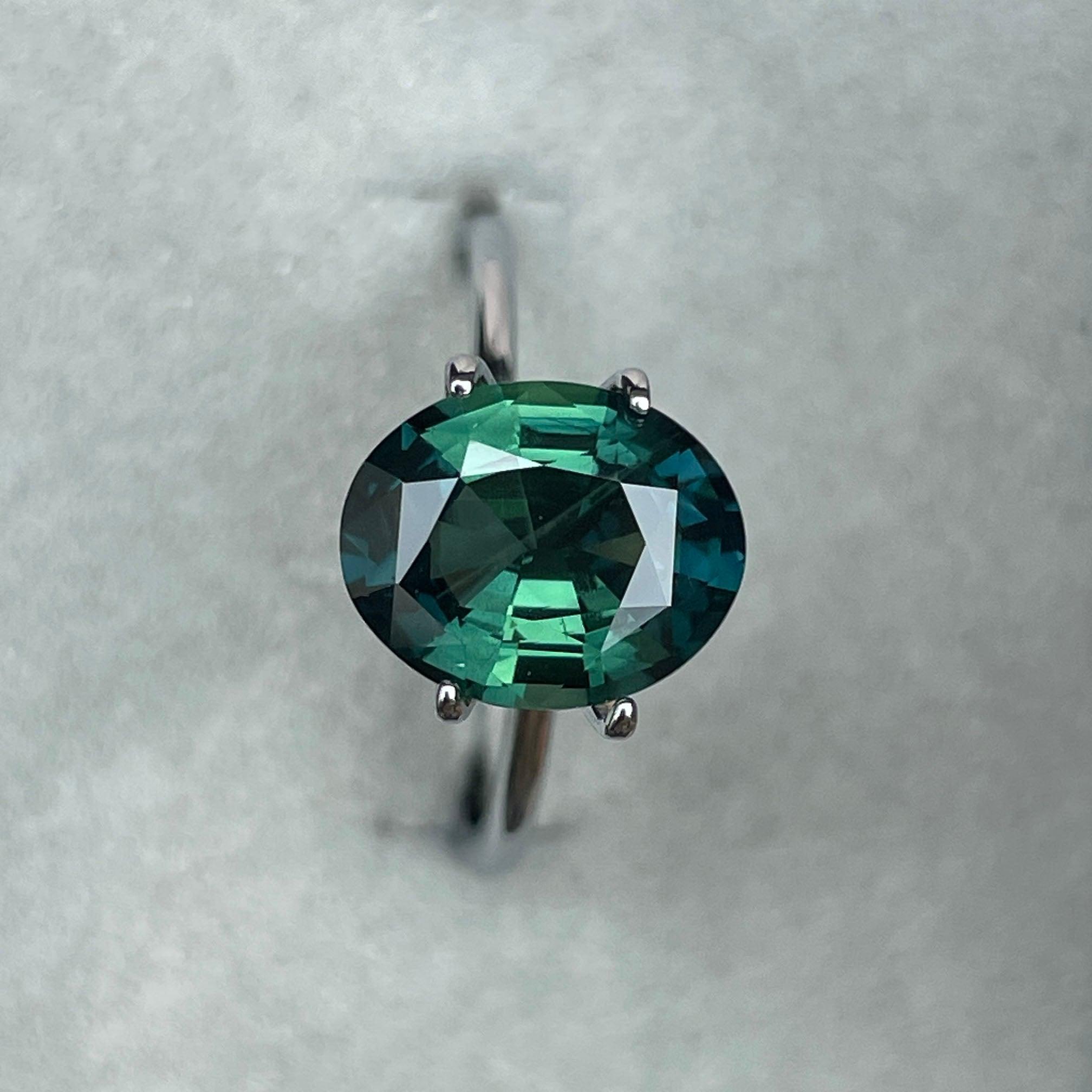 teal blue green parti sapphire oval cut gem