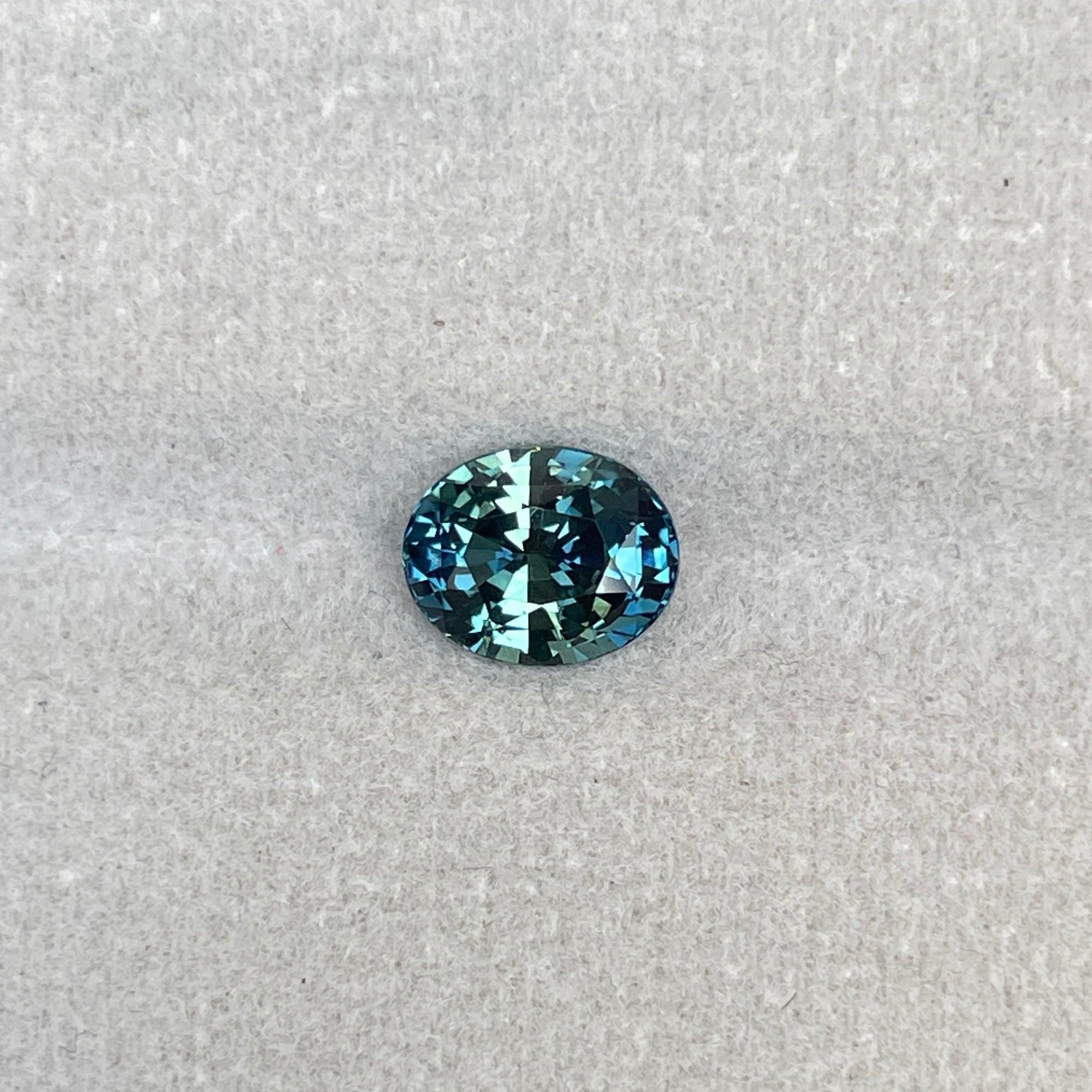 teal blue green parti sapphire oval cut gem