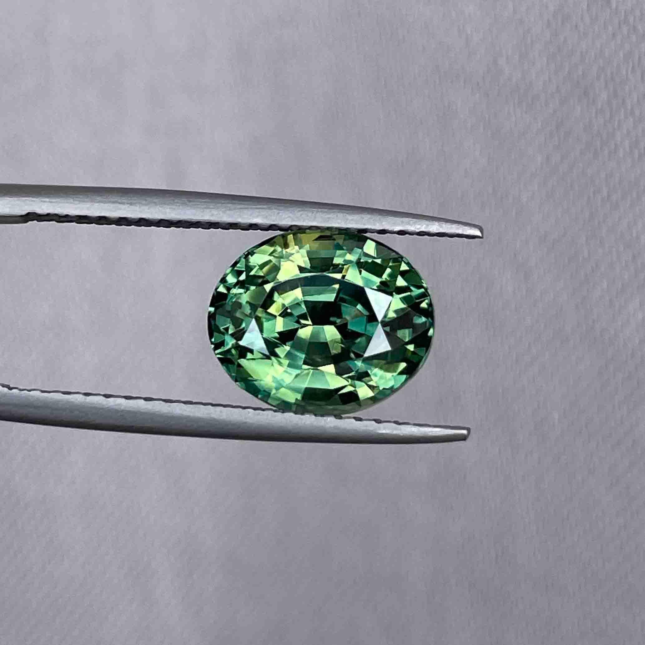 teal blue green parti sapphire oval cut gem