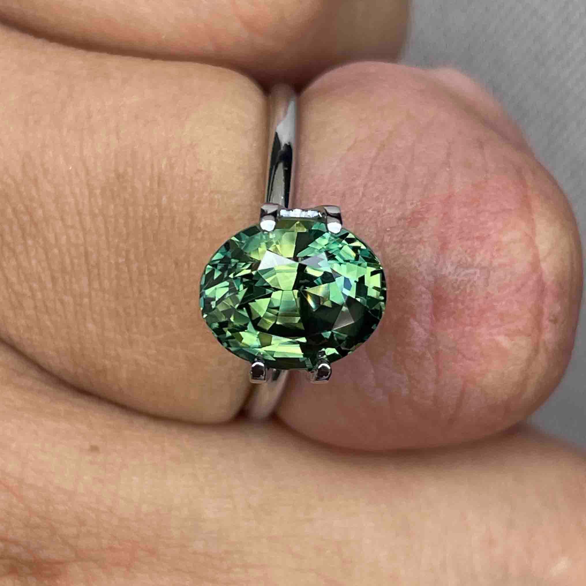teal blue green parti sapphire oval cut gem