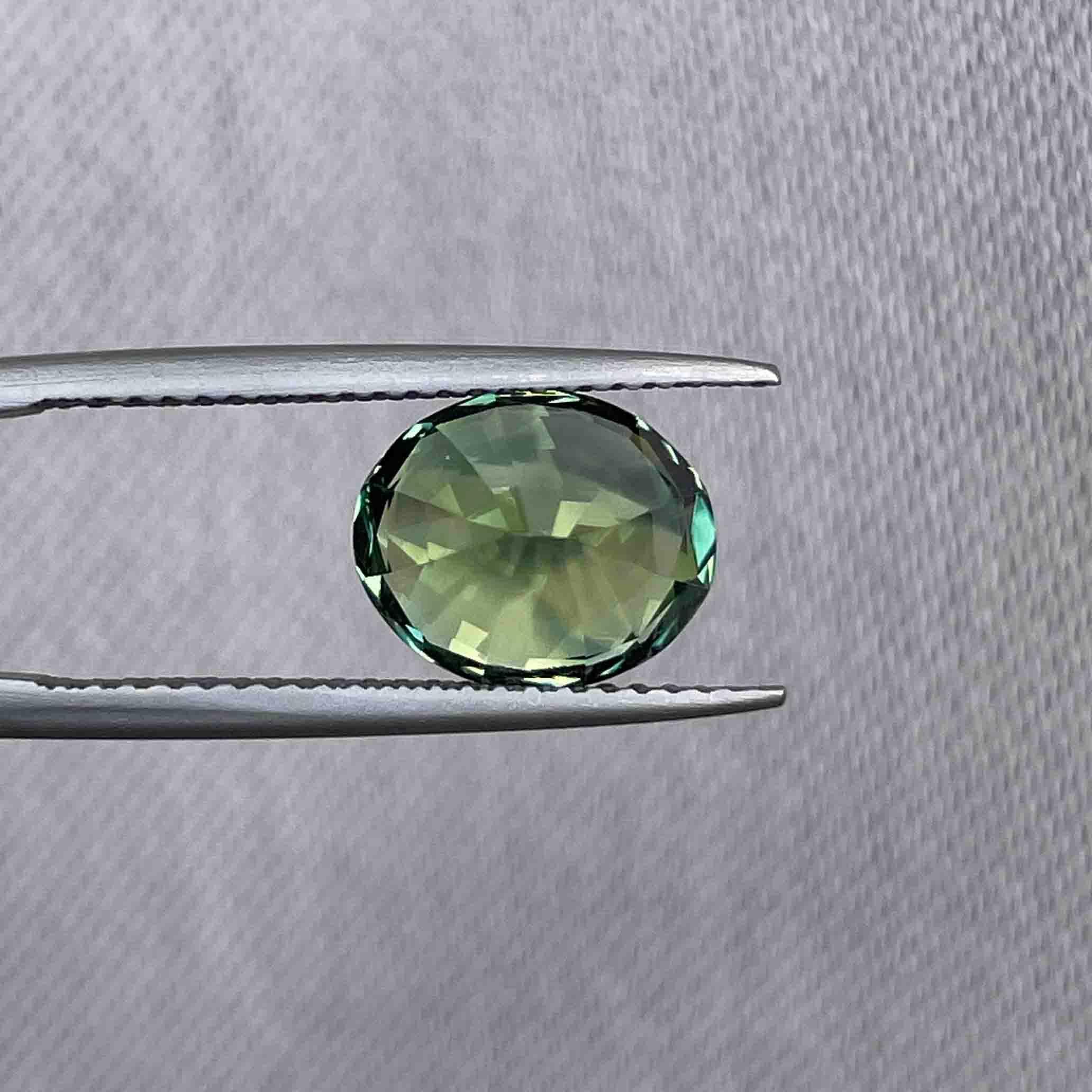 teal blue green parti sapphire oval cut gem