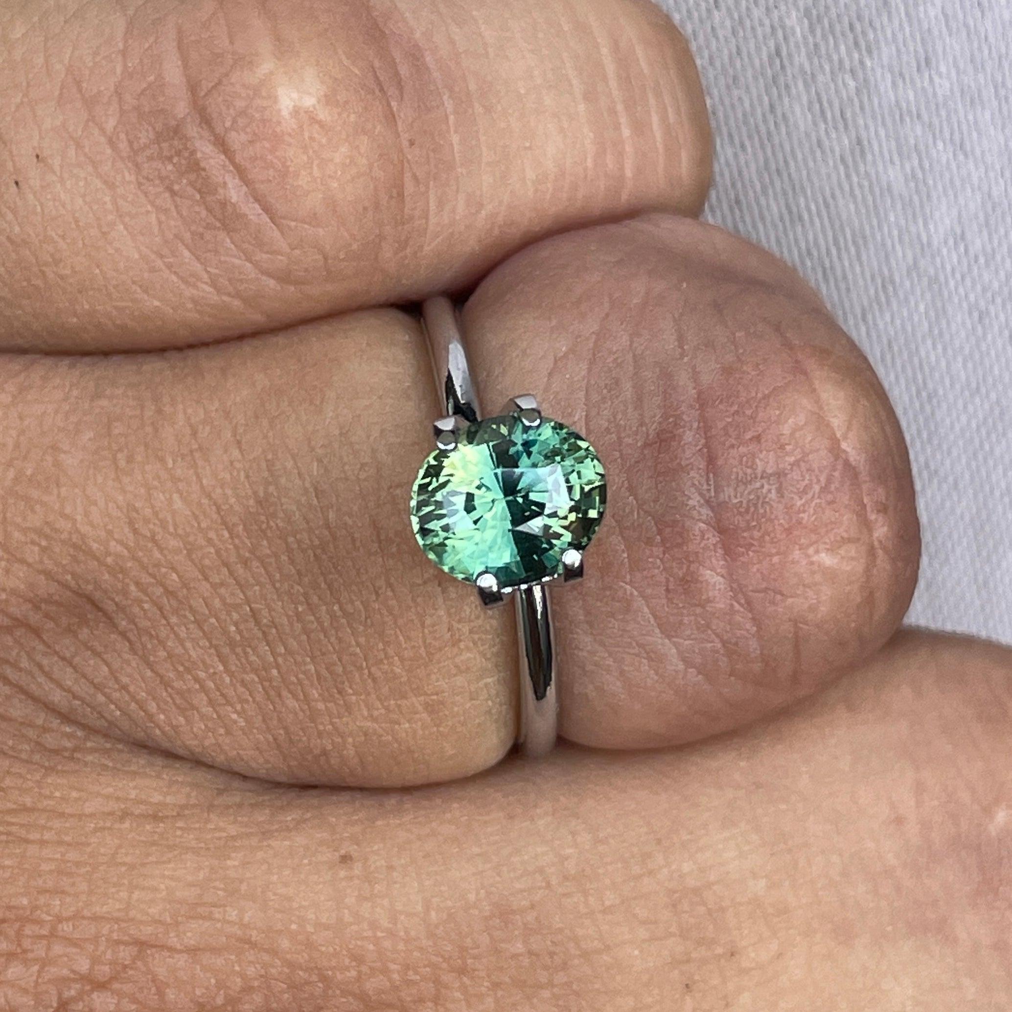 teal blue green parti sapphire oval cut gem