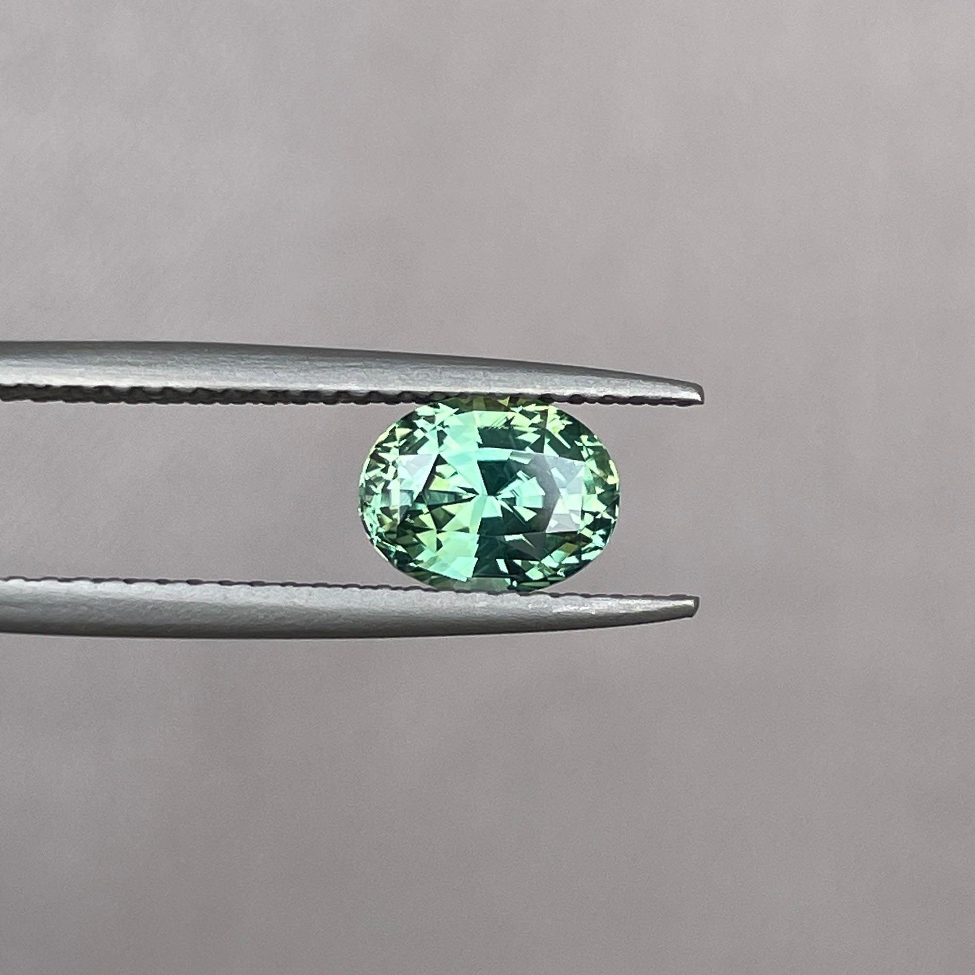 teal blue green parti sapphire oval cut gem
