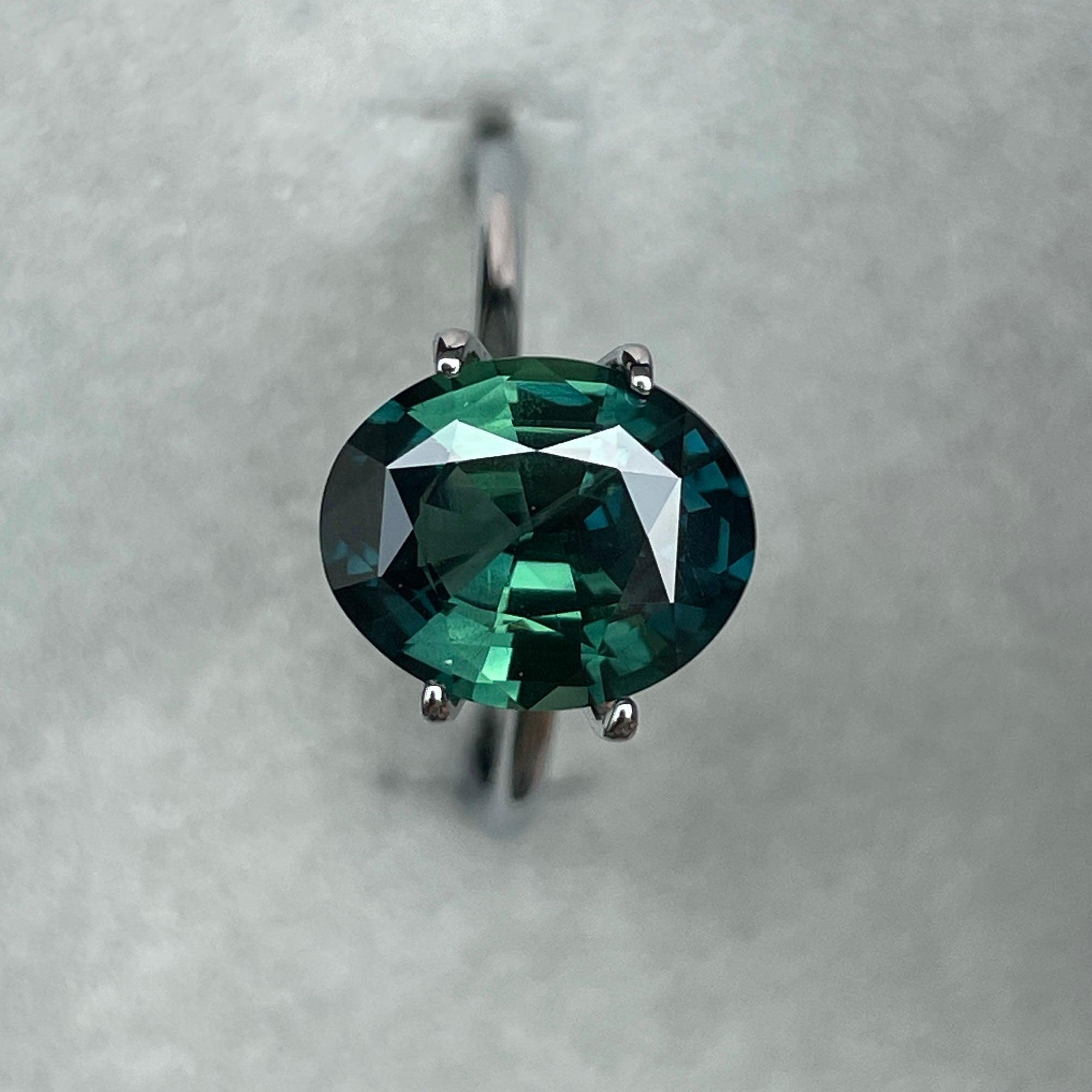 teal blue green parti sapphire oval cut gem