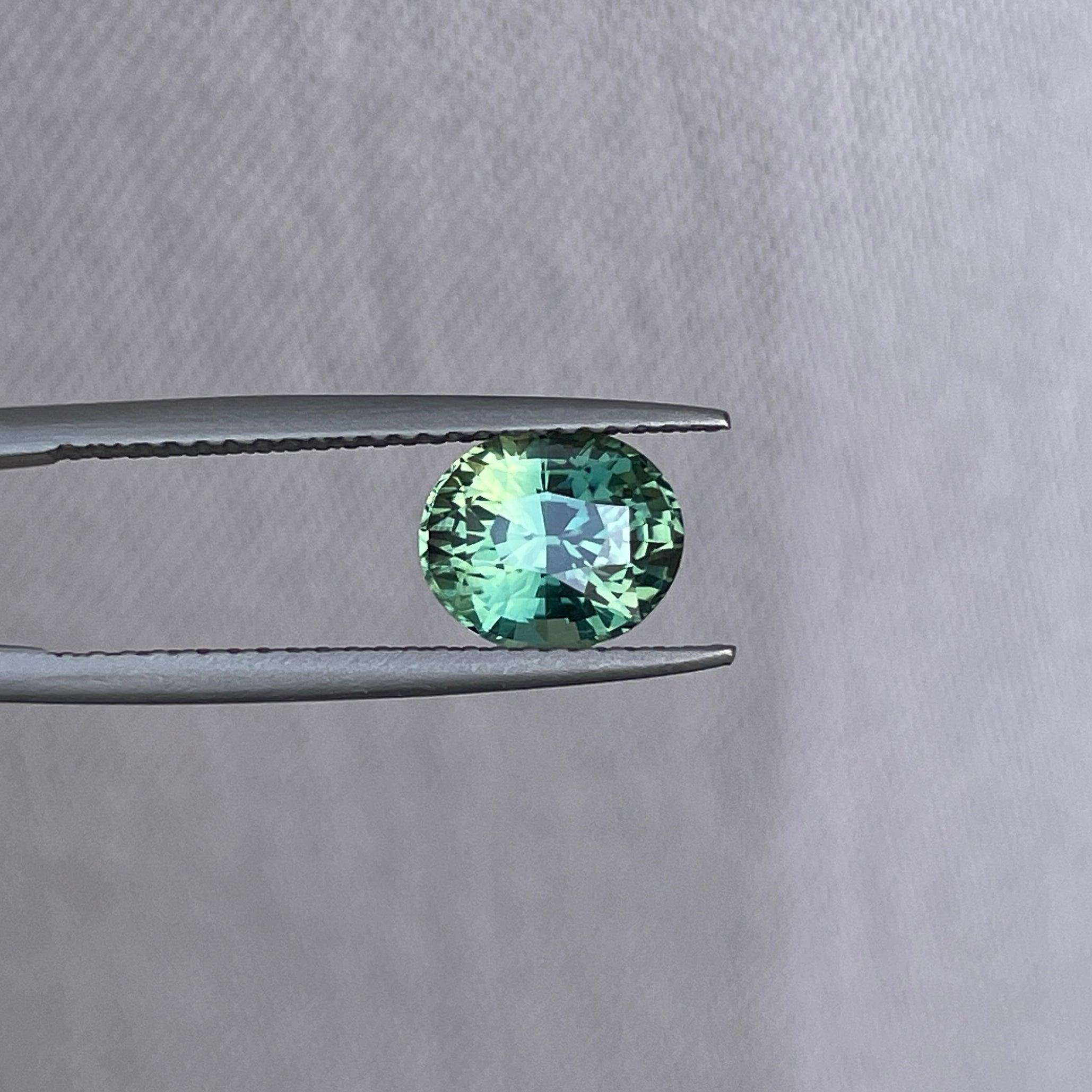 teal blue green parti sapphire oval cut gem