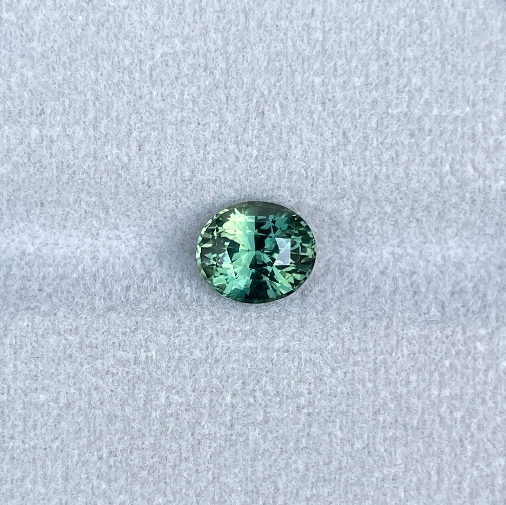teal blue green parti sapphire oval cut gem