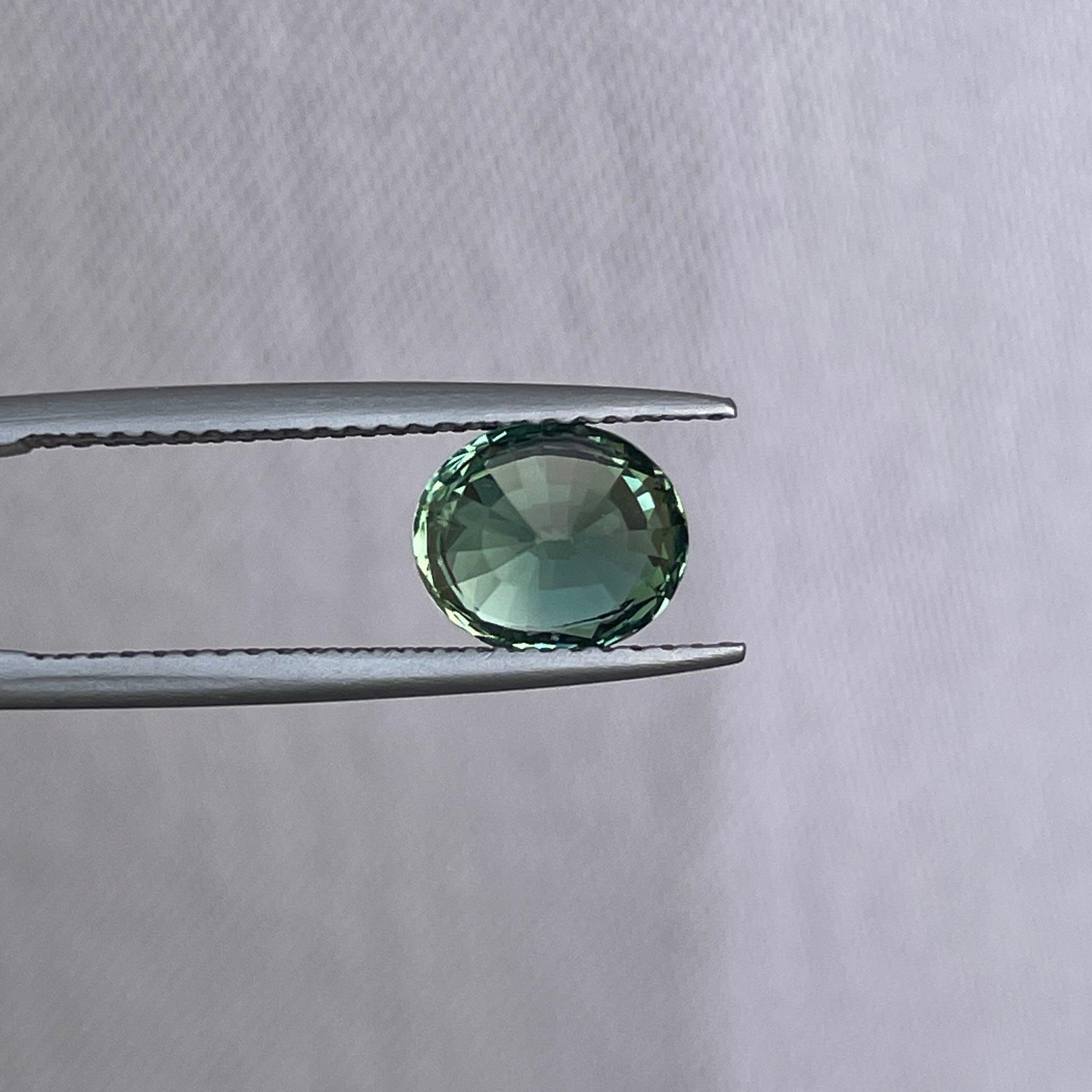 teal blue green parti sapphire oval cut gem
