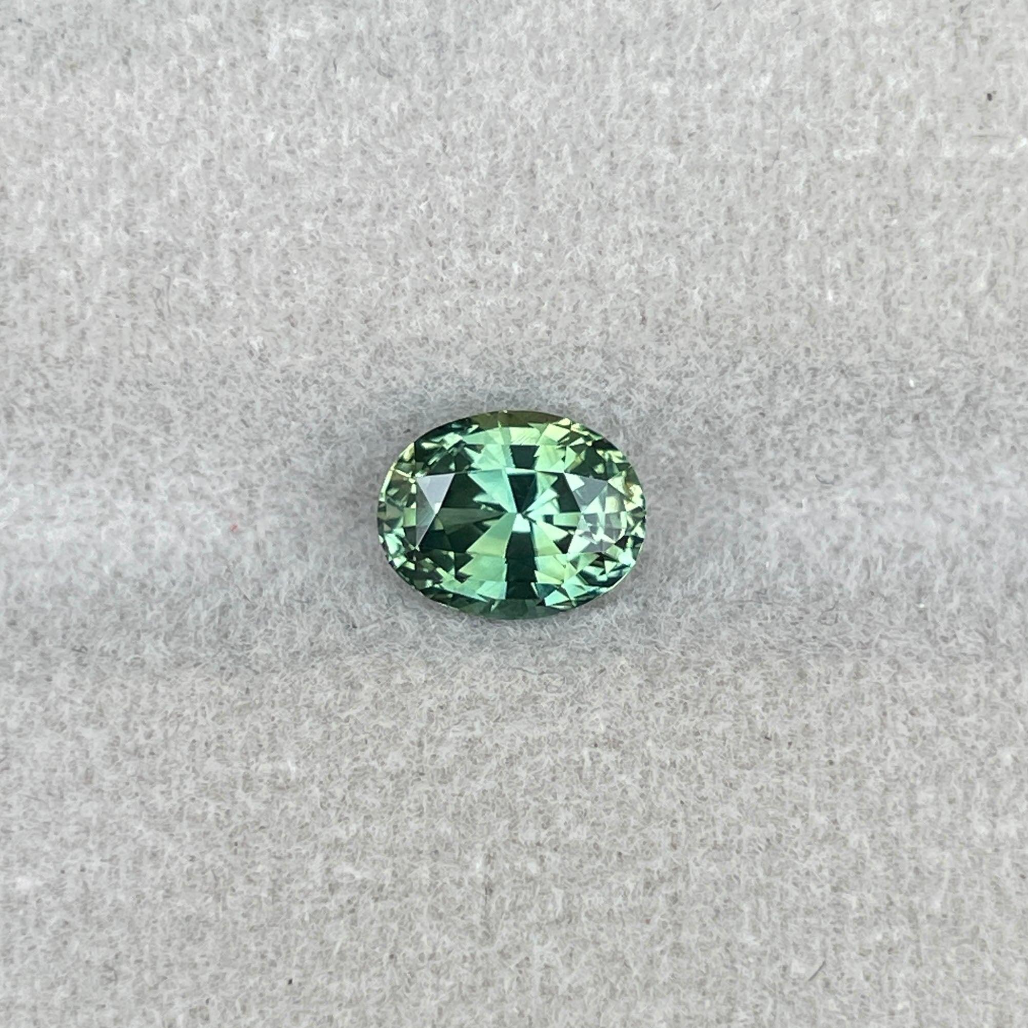 teal blue green parti sapphire oval cut gem