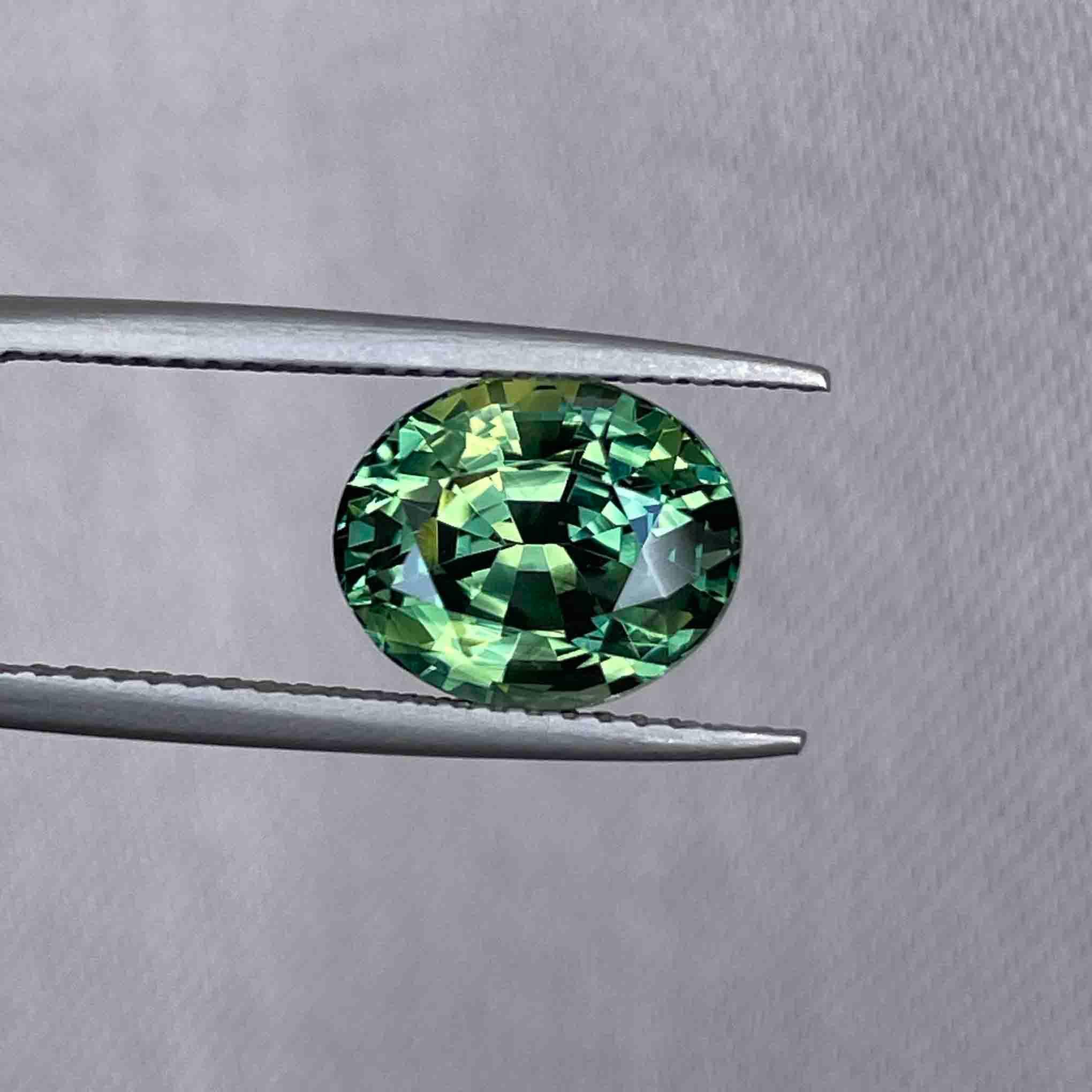 teal blue green parti sapphire oval cut gem