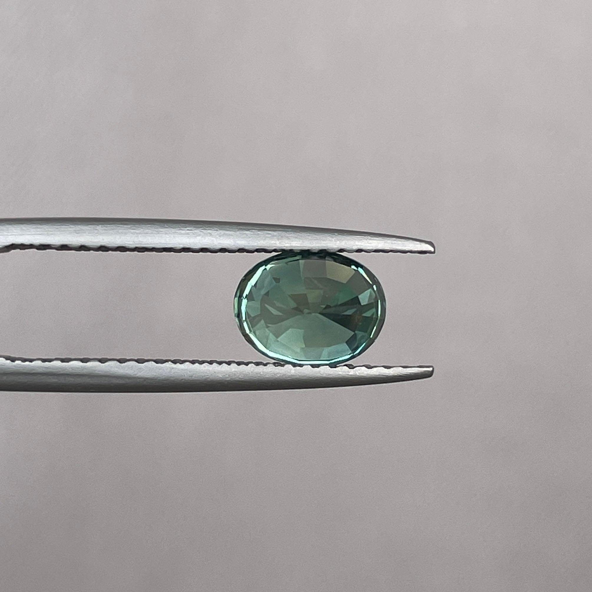teal blue green parti sapphire oval cut gem