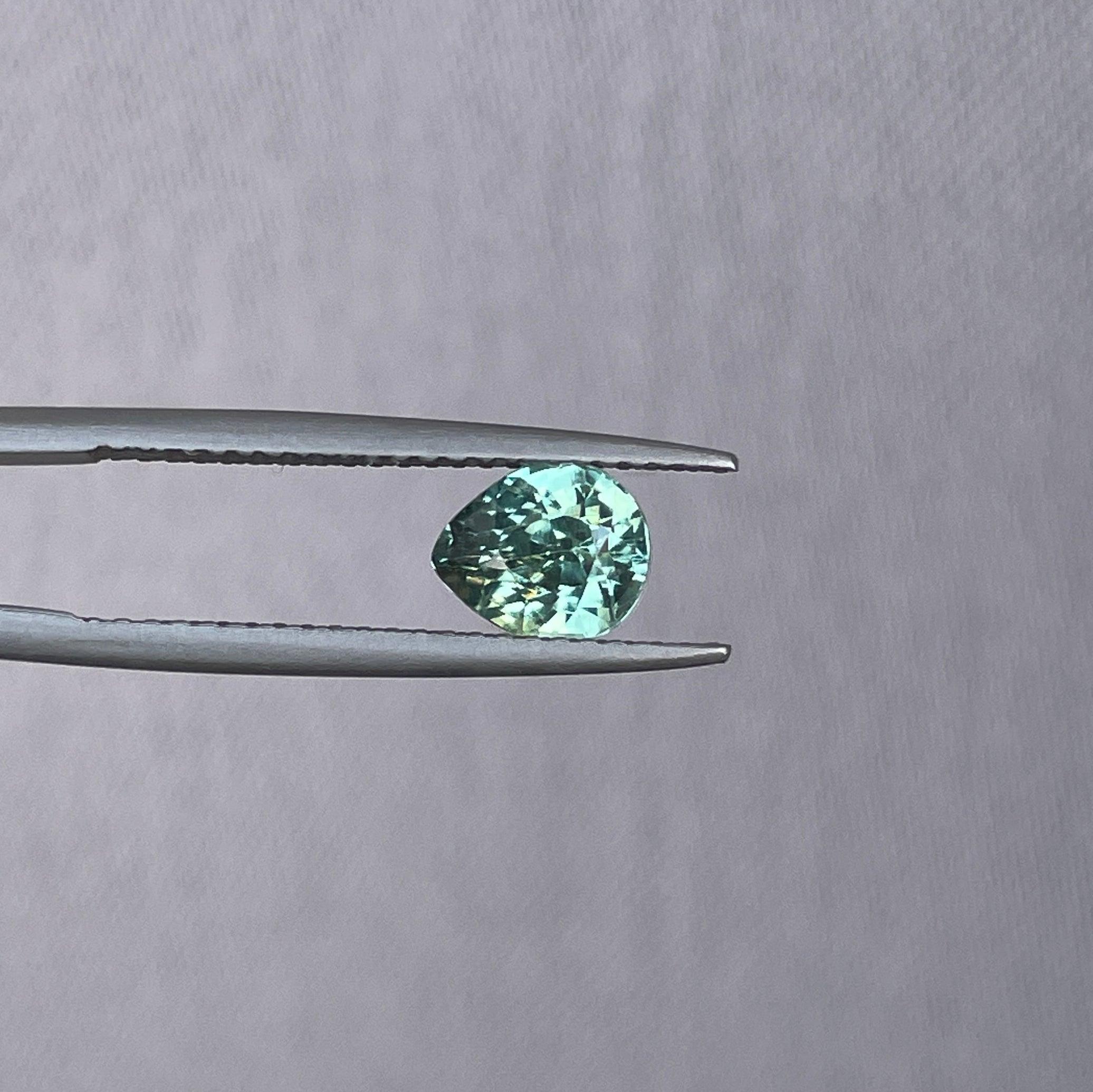 teal blue green parti sapphire pear drop cut gem