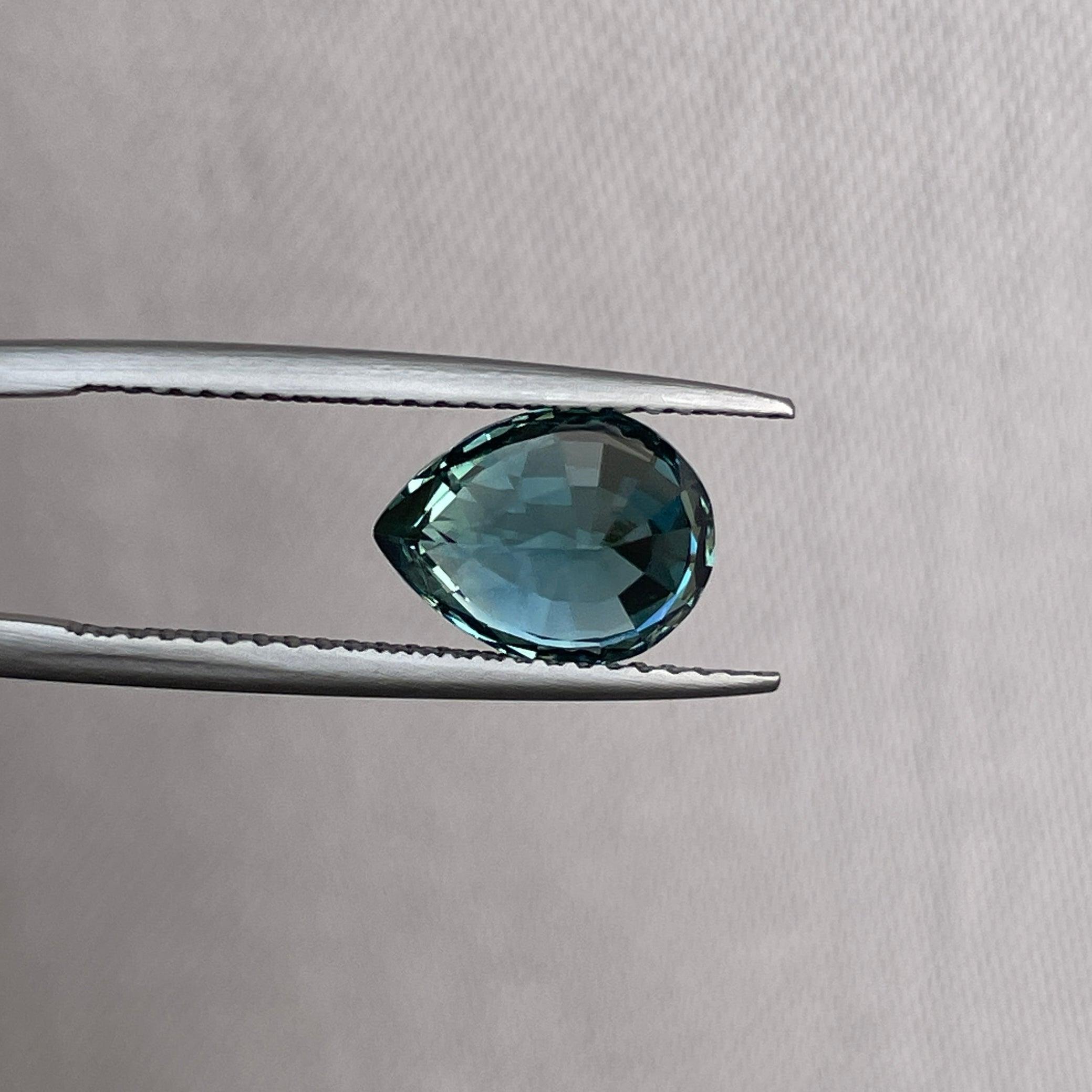 teal blue green parti sapphire pear drop cut gem