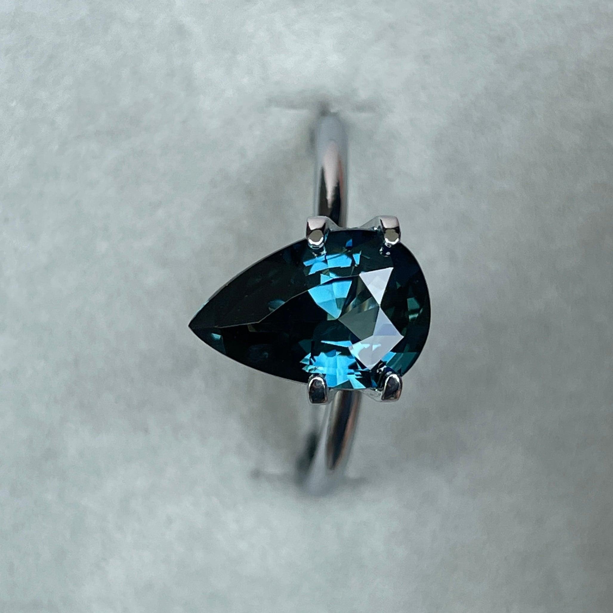 teal blue green parti sapphire pear drop cut gem