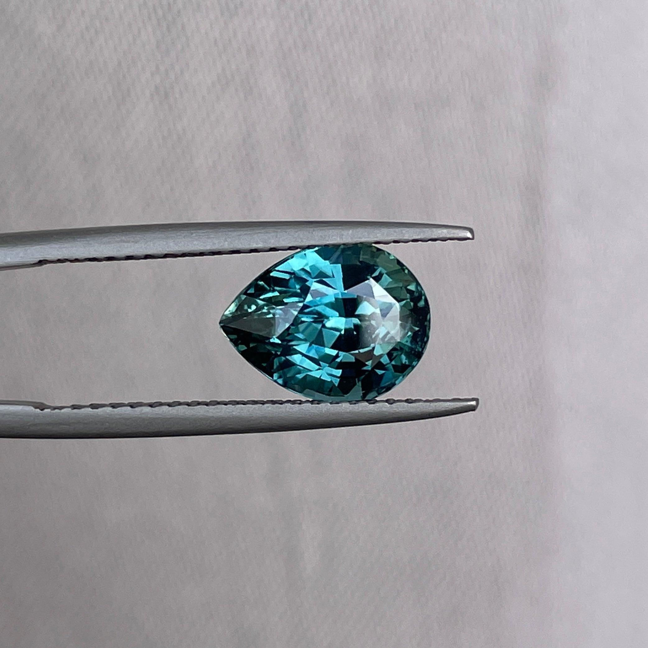 teal blue green parti sapphire pear drop cut gem