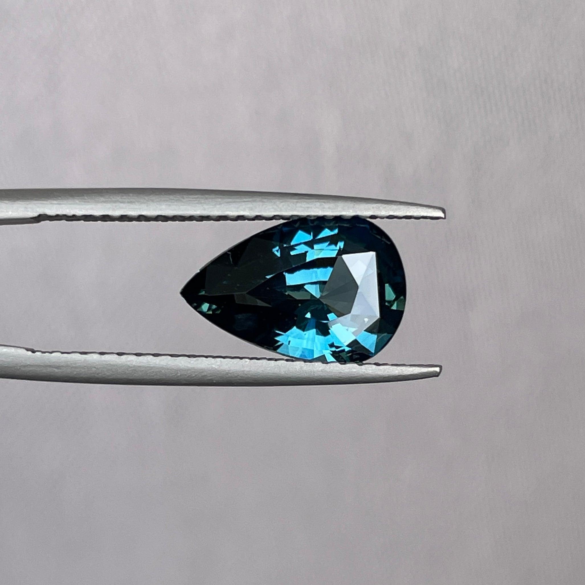 teal blue green parti sapphire pear drop cut gem