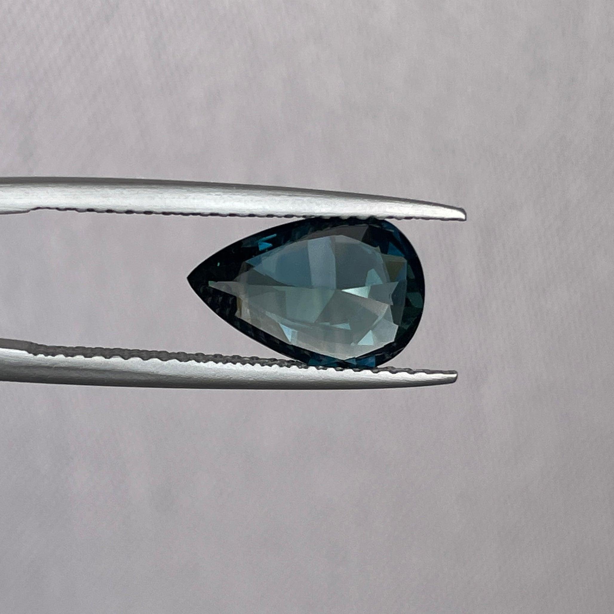 teal blue green parti sapphire pear drop cut gem