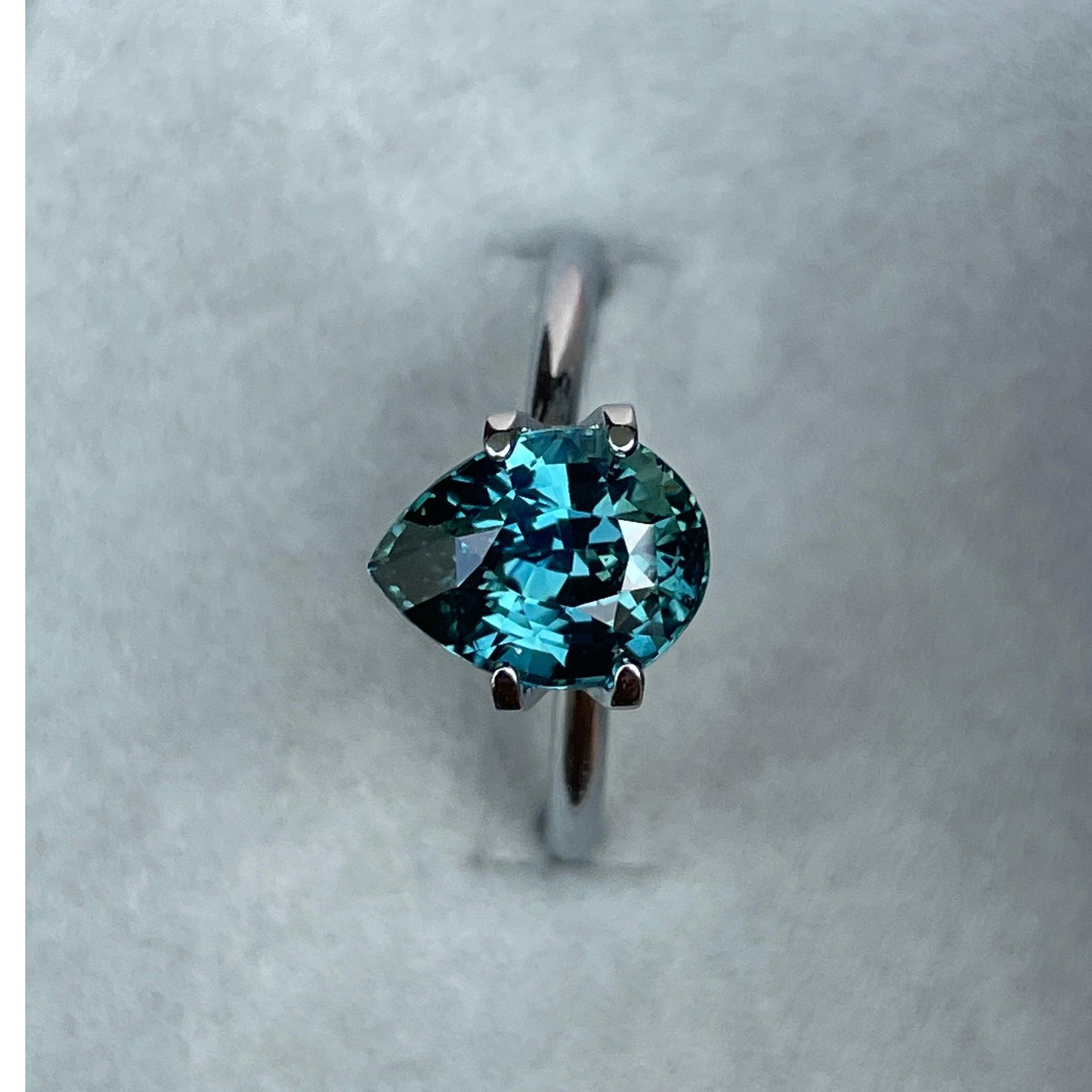 teal blue green parti sapphire pear drop cut gem