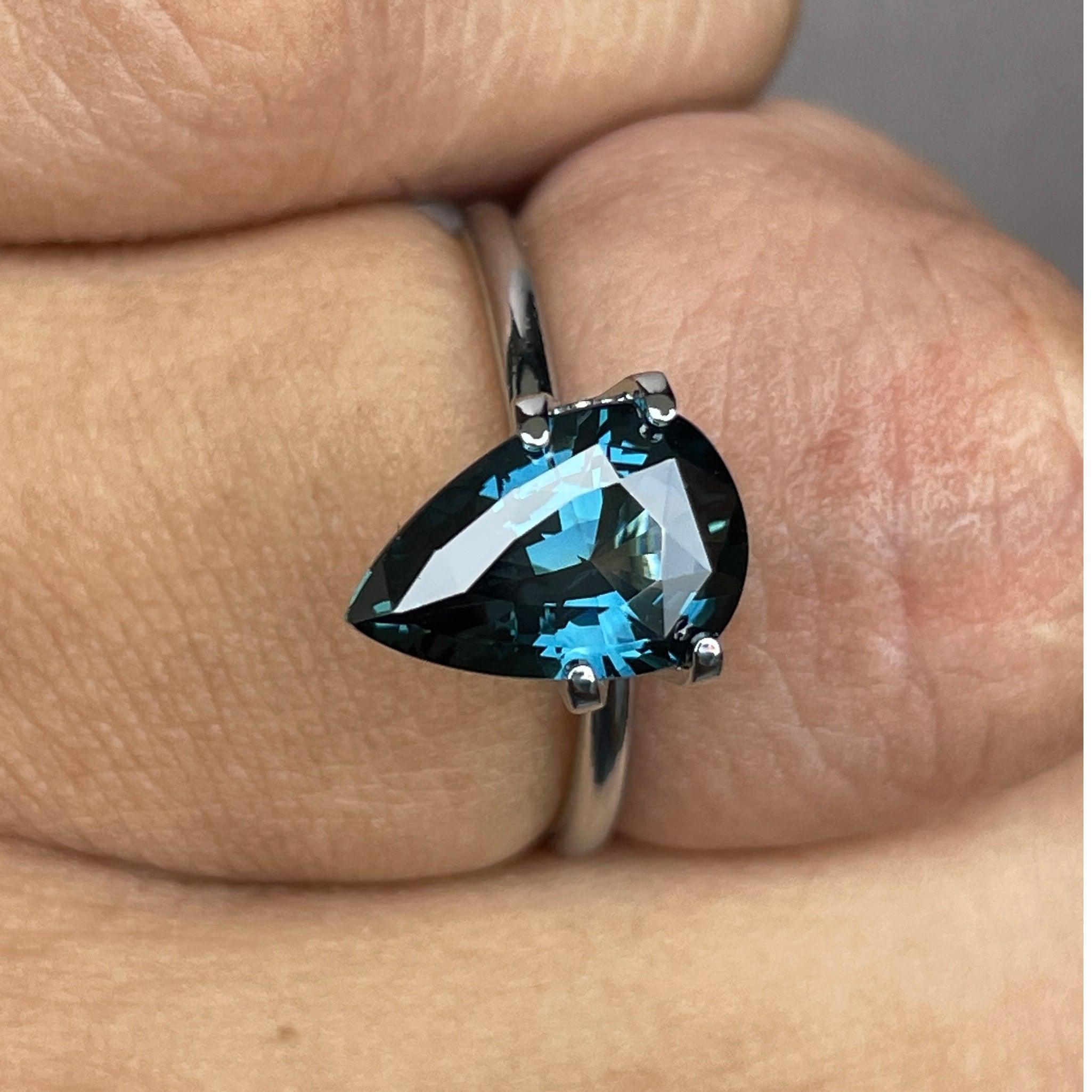 teal blue green parti sapphire pear drop cut gem