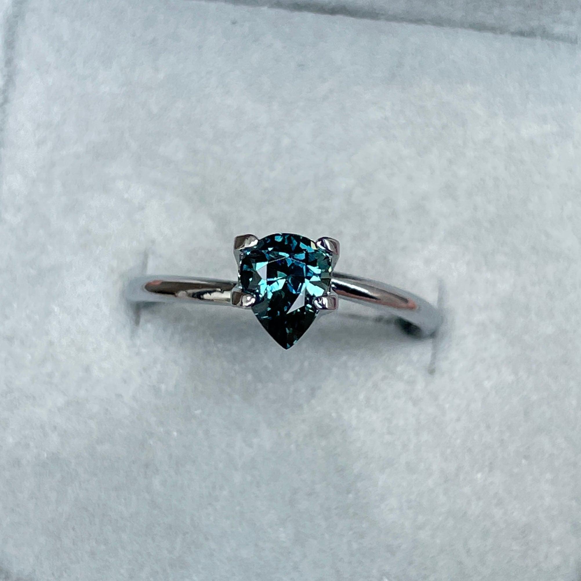 teal blue green parti sapphire pear drop cut gem