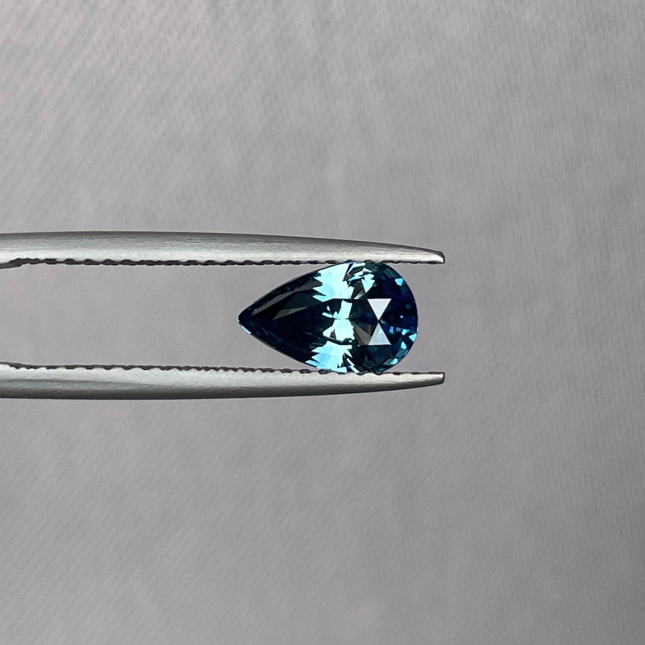 teal blue green parti sapphire pear drop cut gem