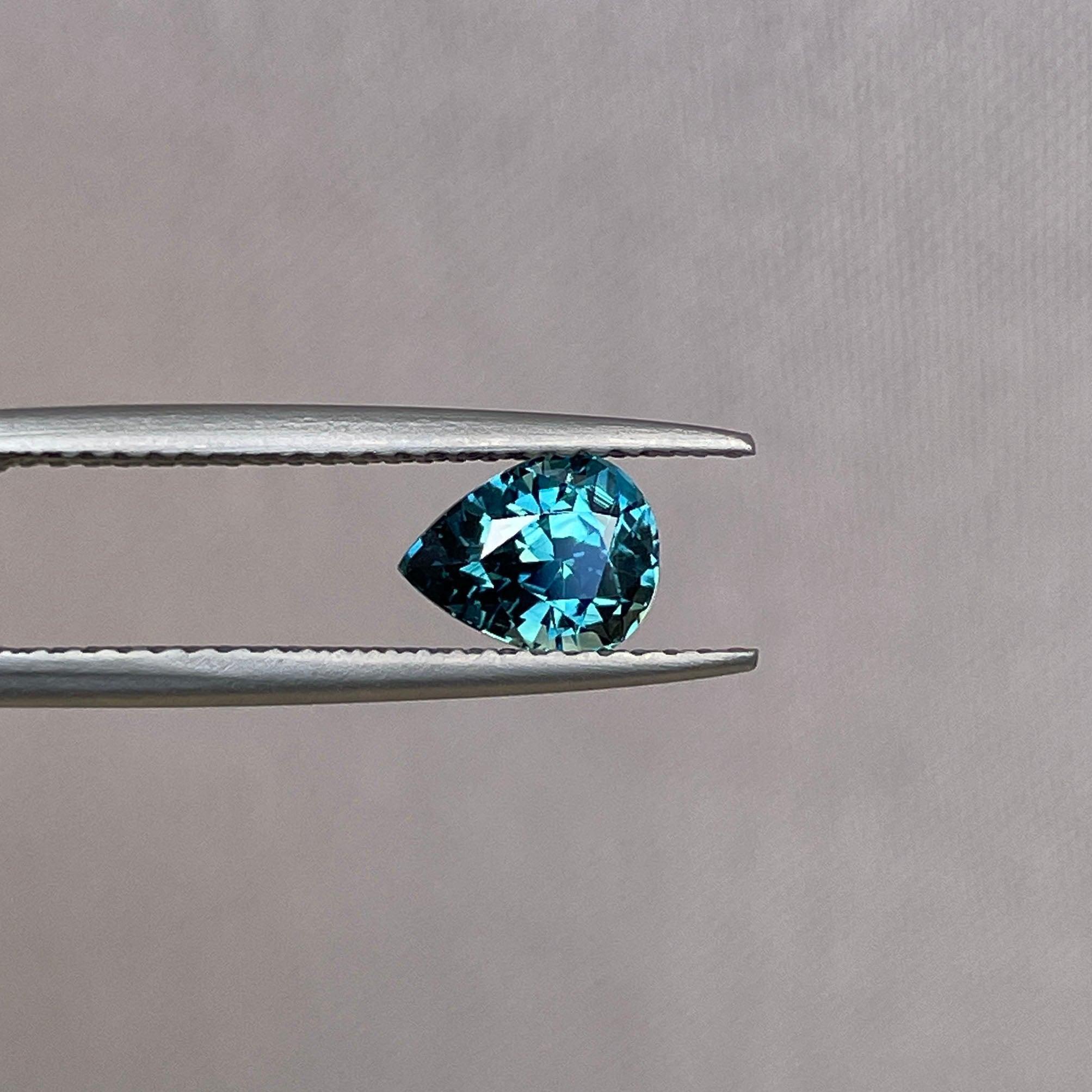 teal blue green parti sapphire pear drop cut gem