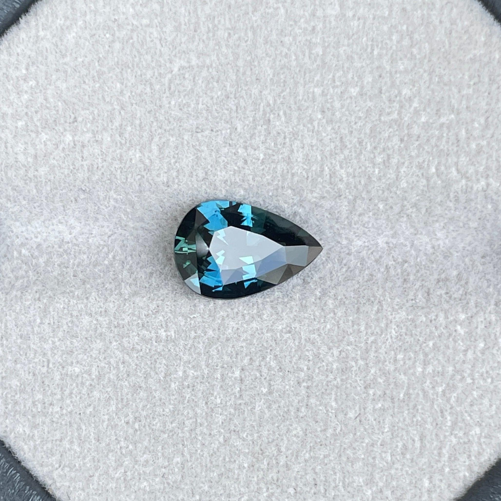 teal blue green parti sapphire pear drop cut gem