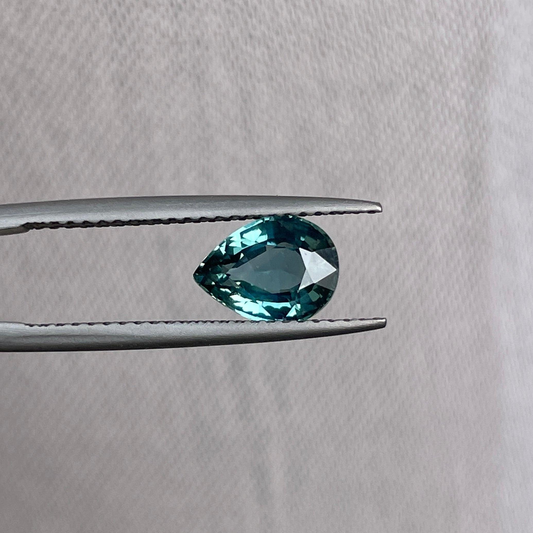 teal blue green parti sapphire pear drop cut gem