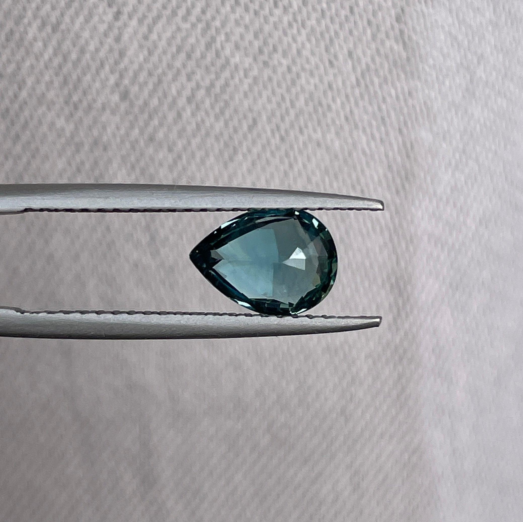 teal blue green parti sapphire pear drop cut gem