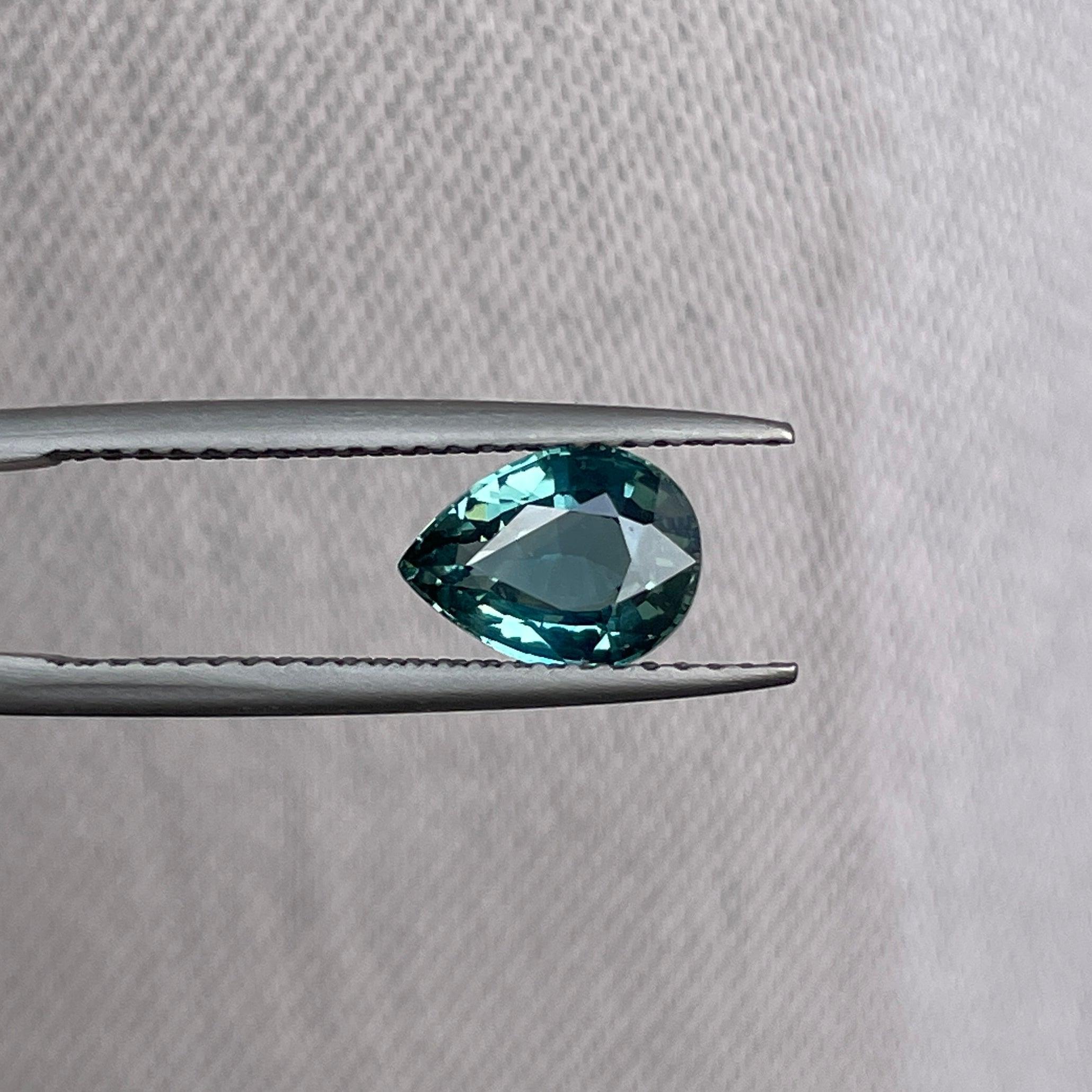teal blue green parti sapphire pear drop cut gem