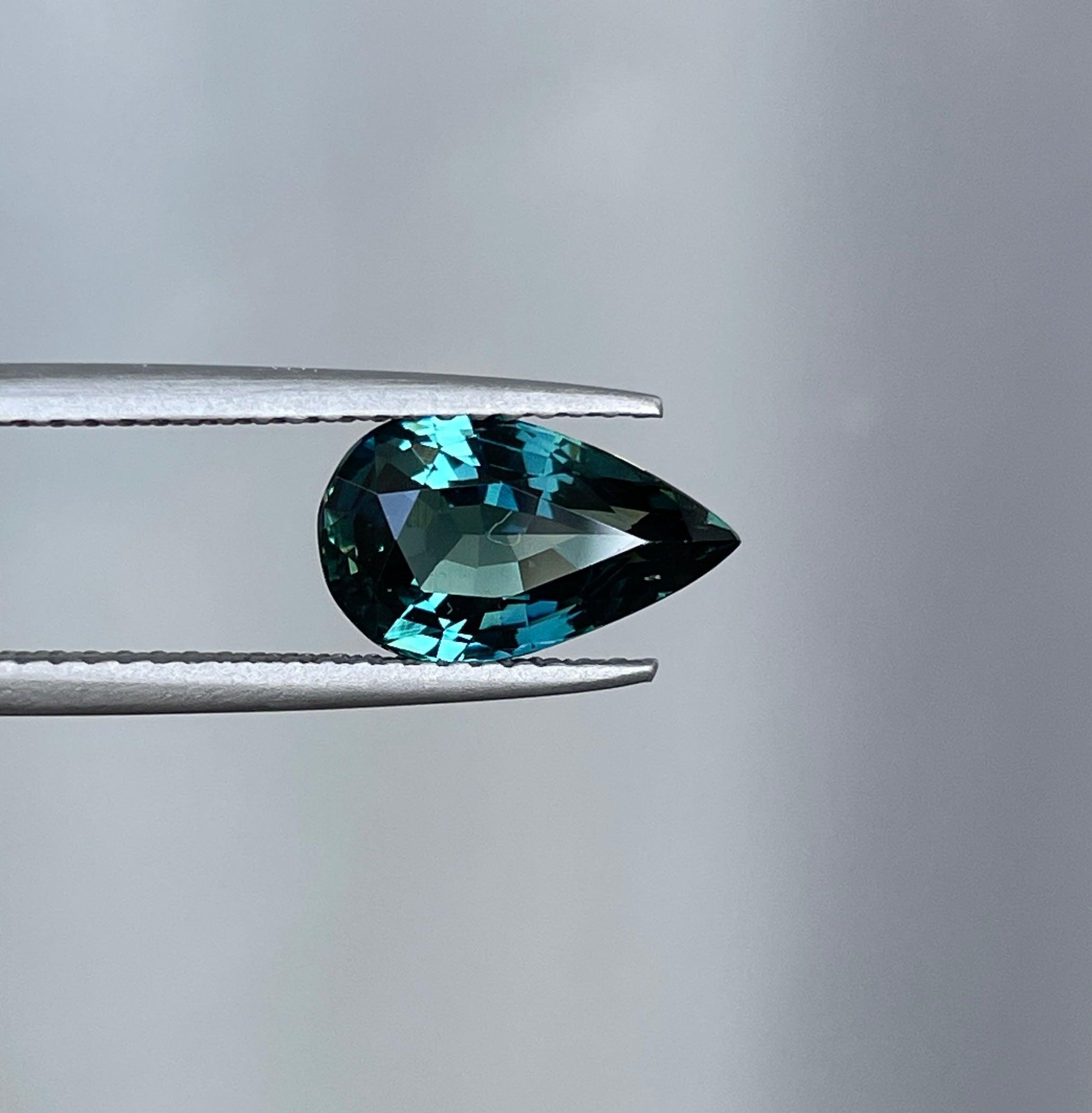 teal blue green parti sapphire pear drop cut gem