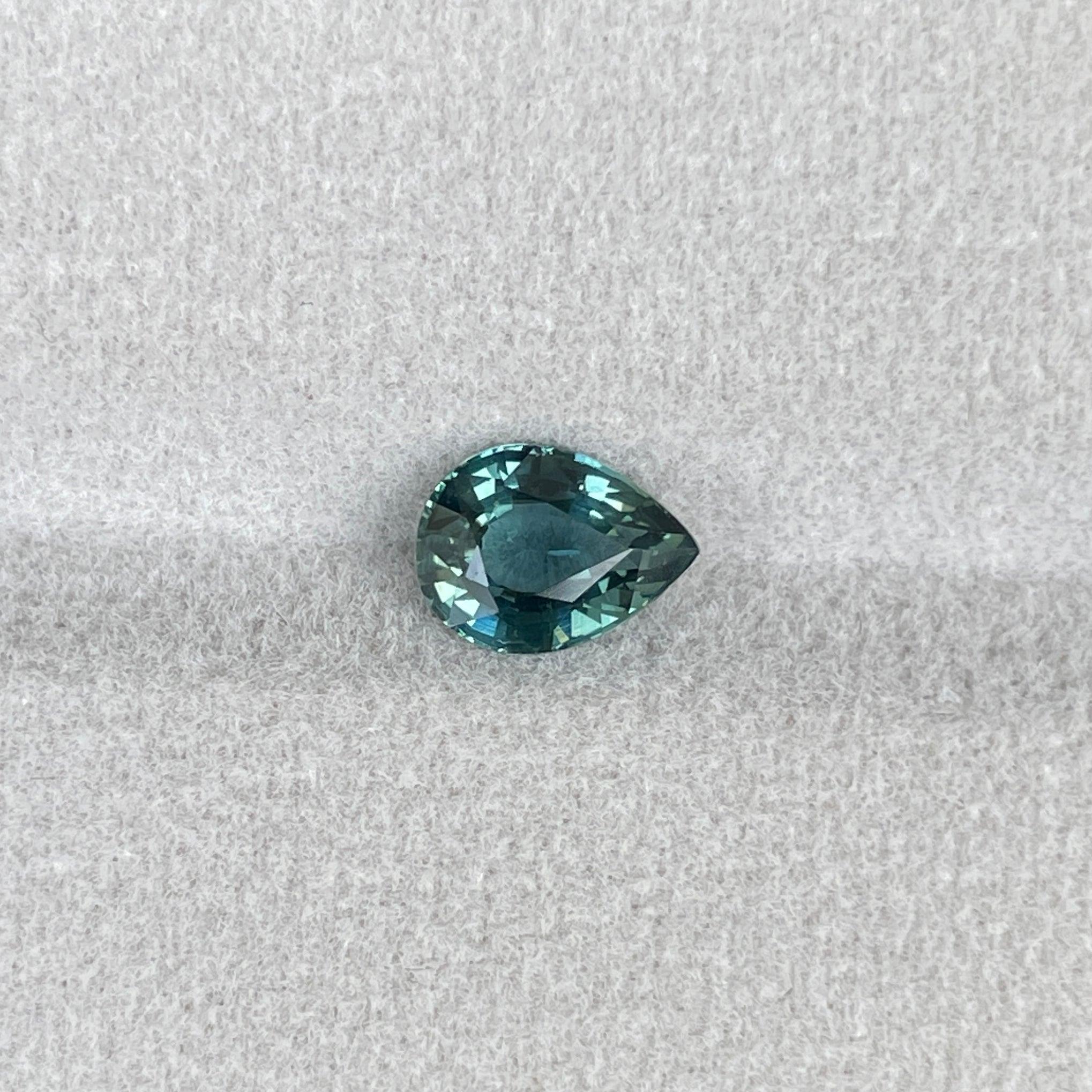 teal blue green parti sapphire pear drop cut gem
